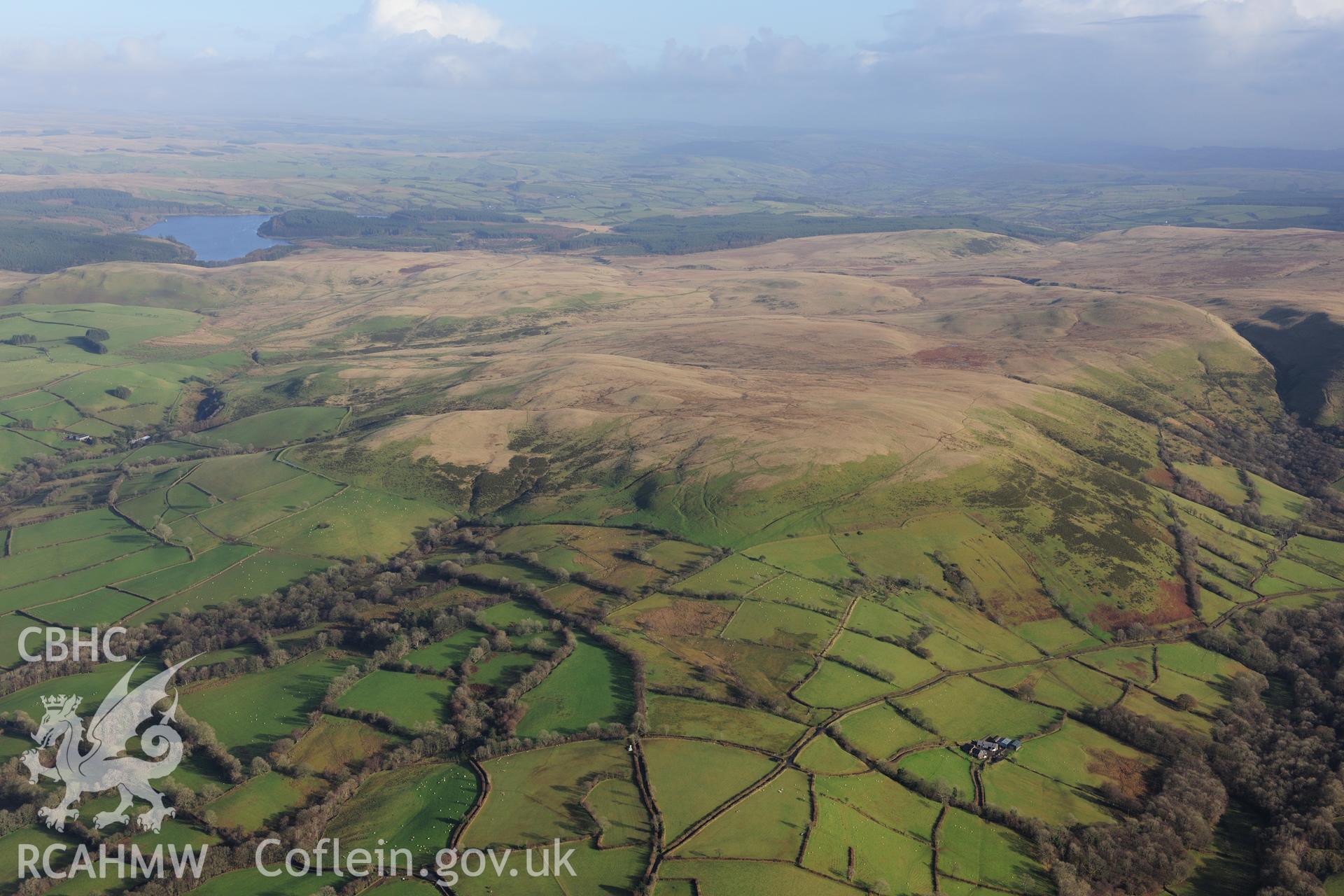 RCAHMW colour oblique photograph of Arosfa Garreg Lwyd Roman camp, wide landscape view from south-west, showing setting. Taken by Toby Driver on 23/11/2012.