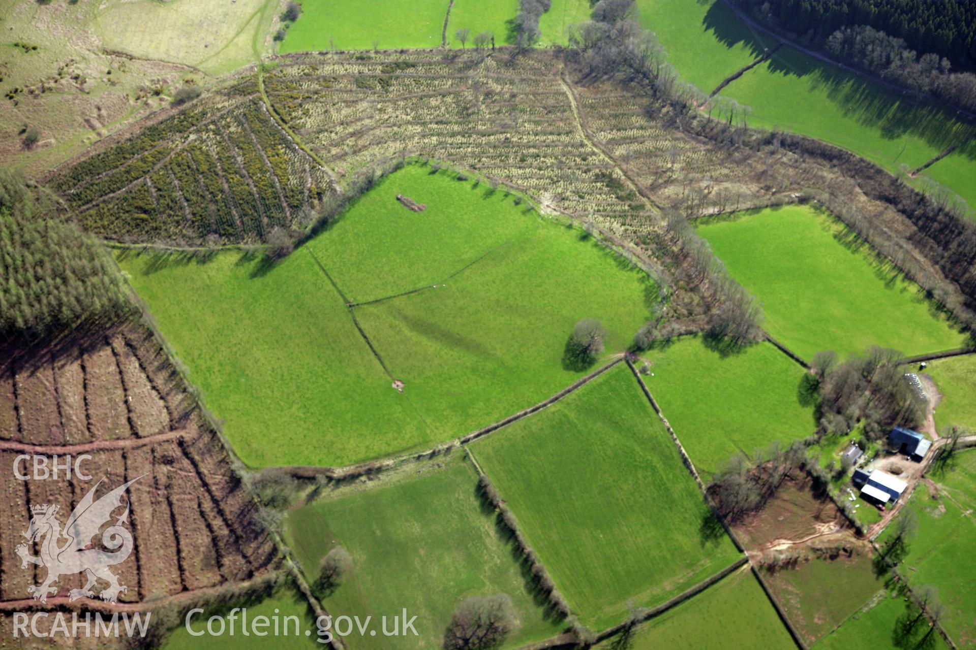 RCAHMW colour oblique photograph of Penpont-fach, denuded hillfort west of Twyn y Gaer hillfort. Taken by Toby Driver and Oliver Davies on 28/03/2012.