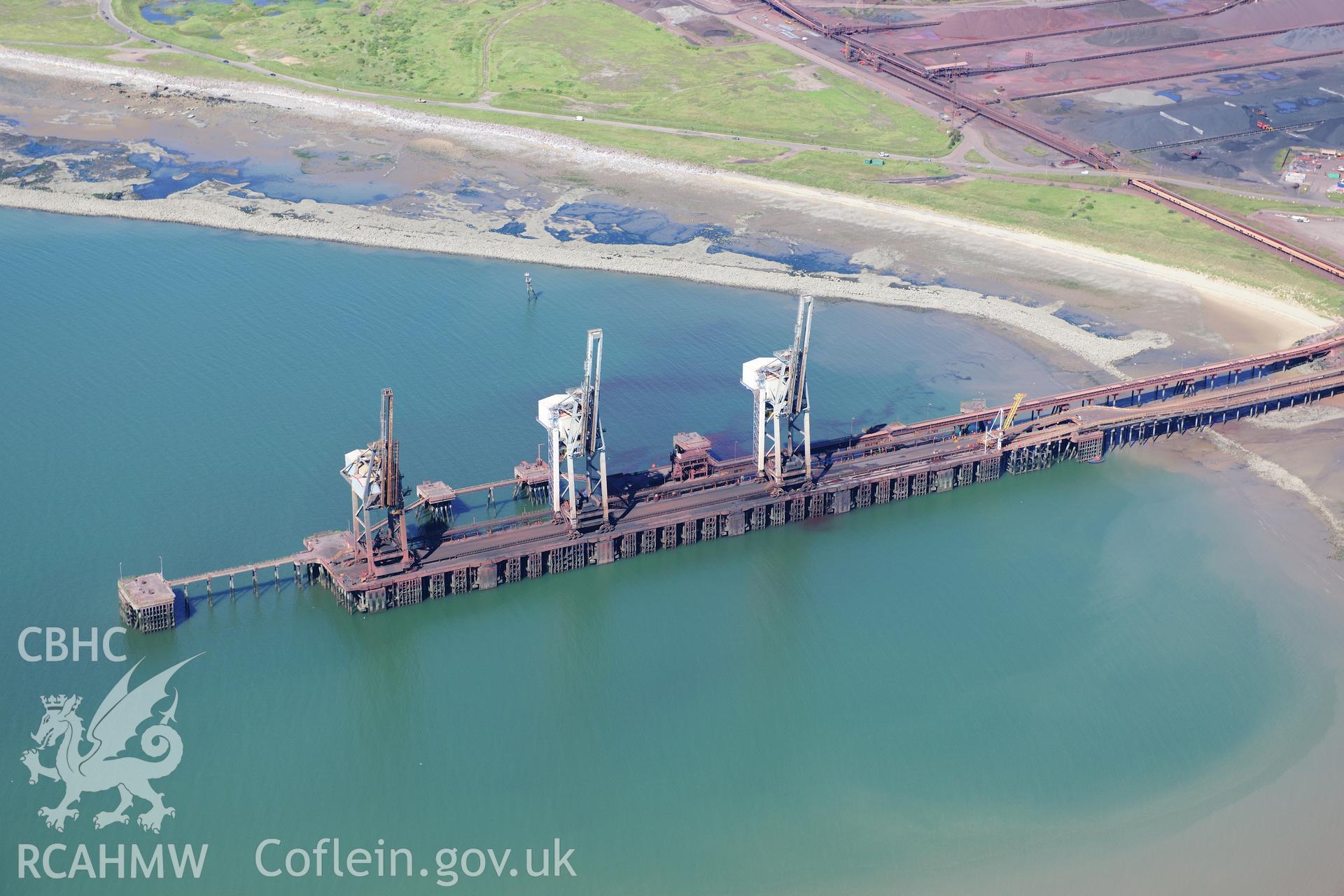 RCAHMW colour oblique photograph of Abbey Works, Margam Steelworks, cranes at dock. Taken by Toby Driver on 24/07/2012.