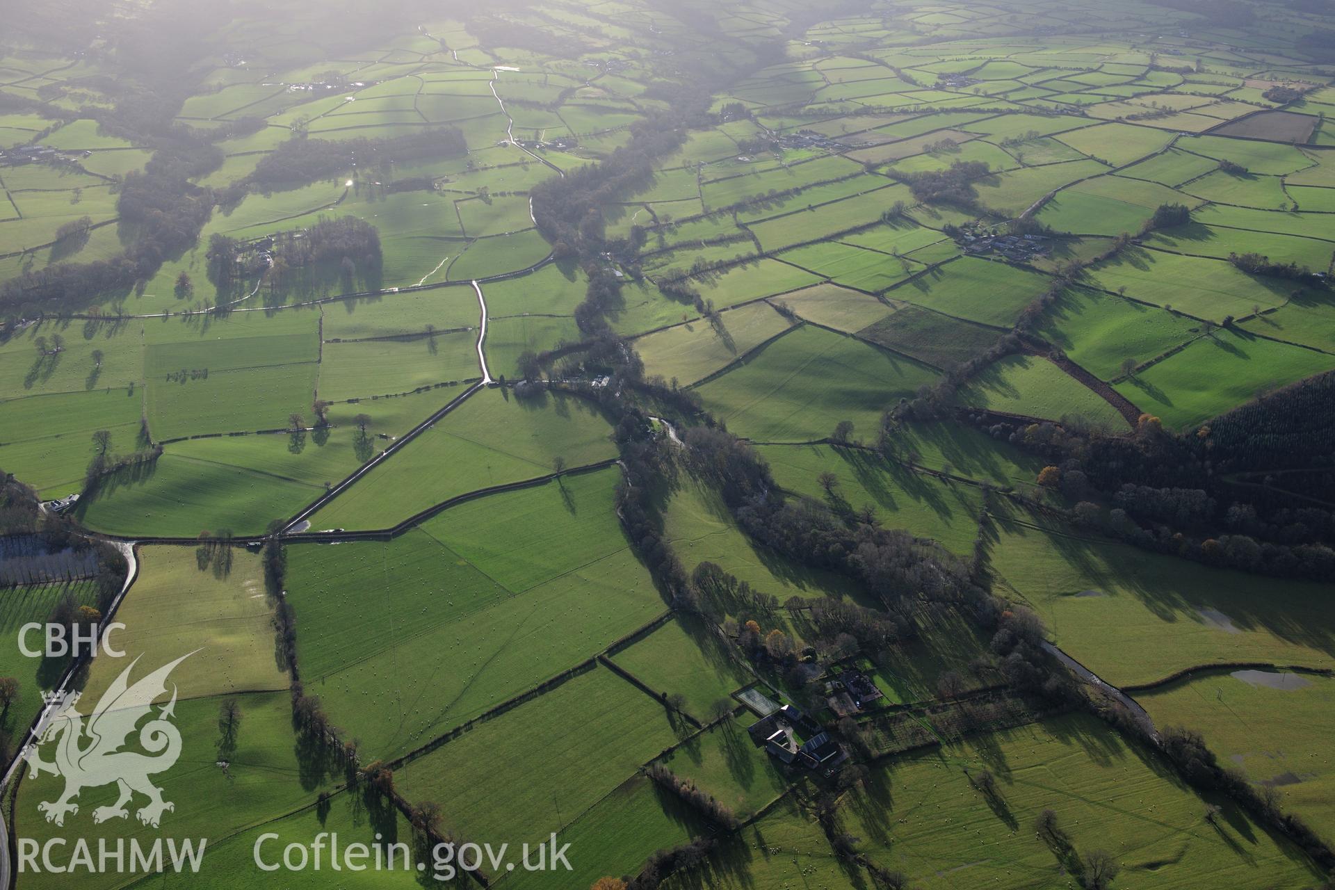 RCAHMW colour oblique photograph of Abercynrig, earthwork boundary to south-east of garden. Taken by Toby Driver on 23/11/2012.