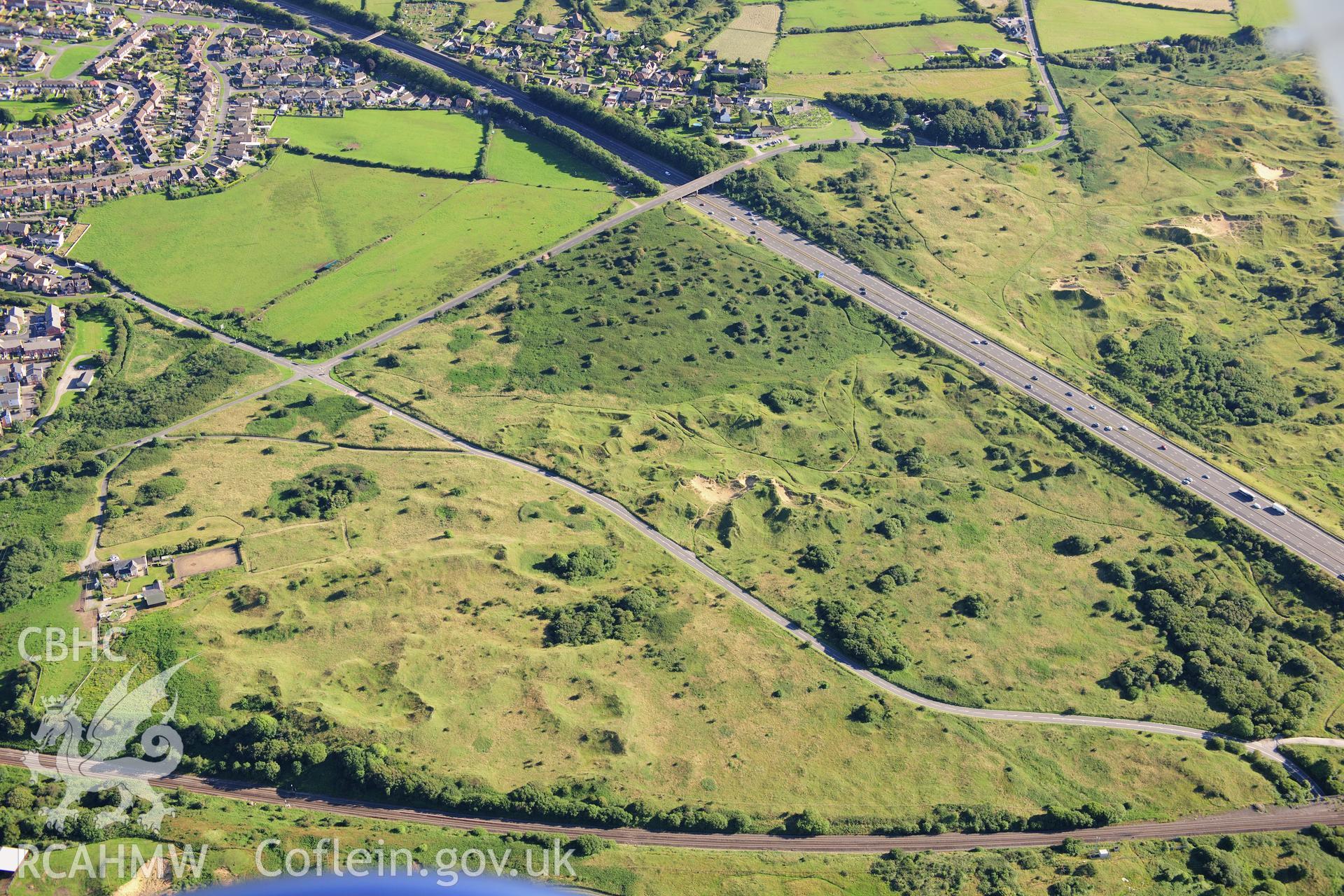 RCAHMW colour oblique photograph of Croes y Ddal enclosure, and dunes. Taken by Toby Driver on 24/07/2012.