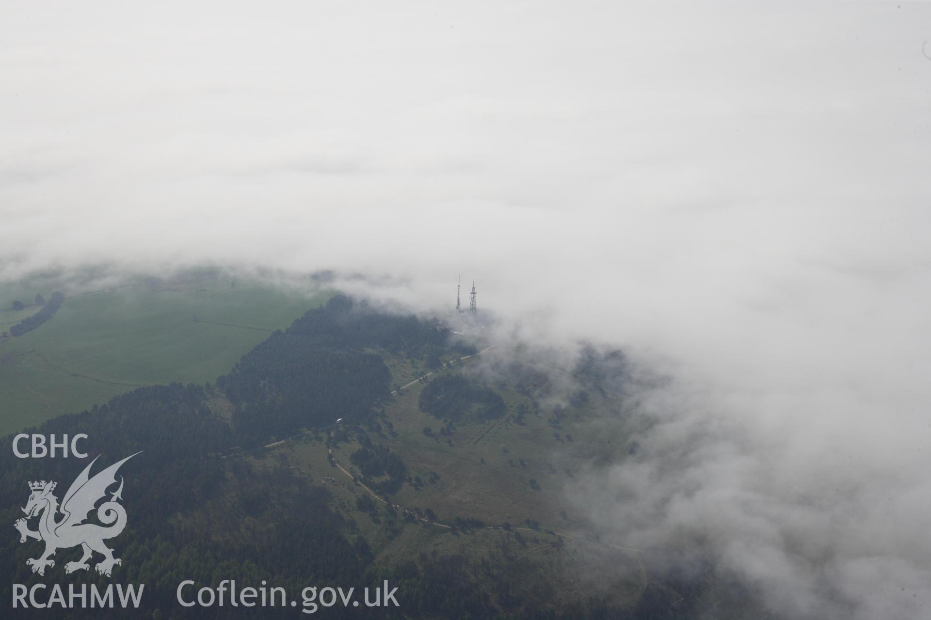 RCAHMW colour oblique photograph of General view of mast adjacent to cairn on Kilvey Hill, looking south east. Taken by Toby Driver on 24/05/2012.