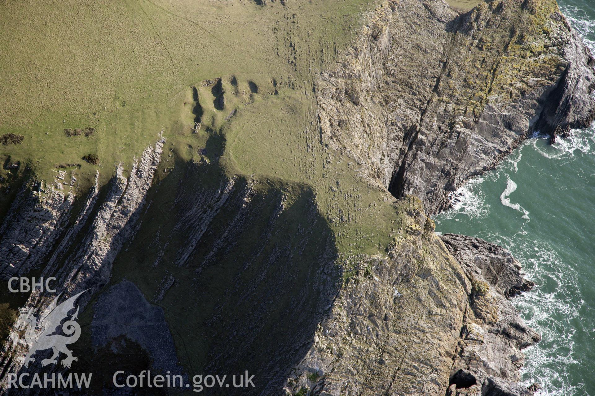 RCAHMW colour oblique photograph of Horsecliff Promontry Fort. Taken by Toby Driver on 02/02/2012.