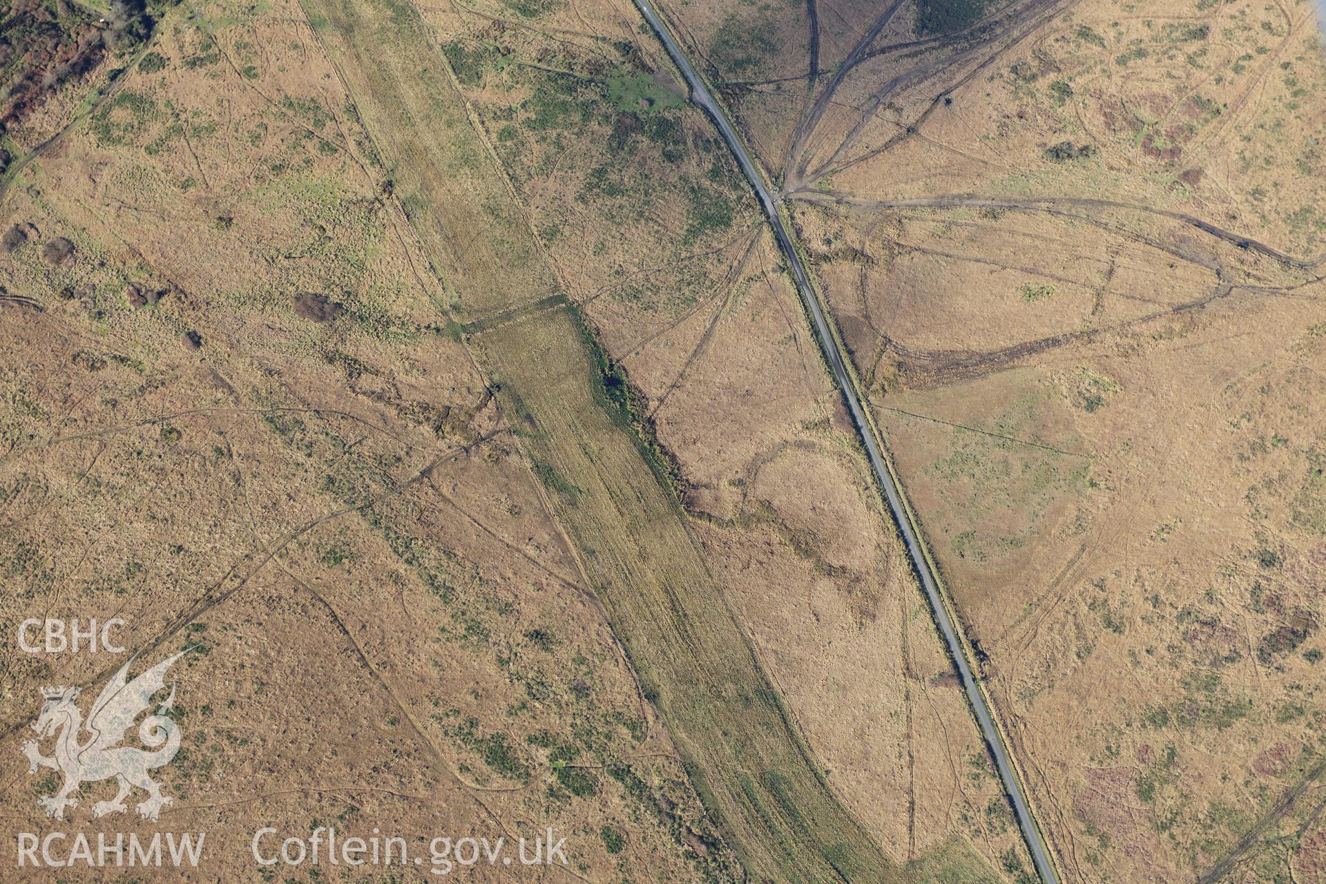 RCAHMW colour oblique photograph of Mynydd Gellionnen cairn, and course of LNG gas pipeline. Taken by Toby Driver on 28/11/2012.