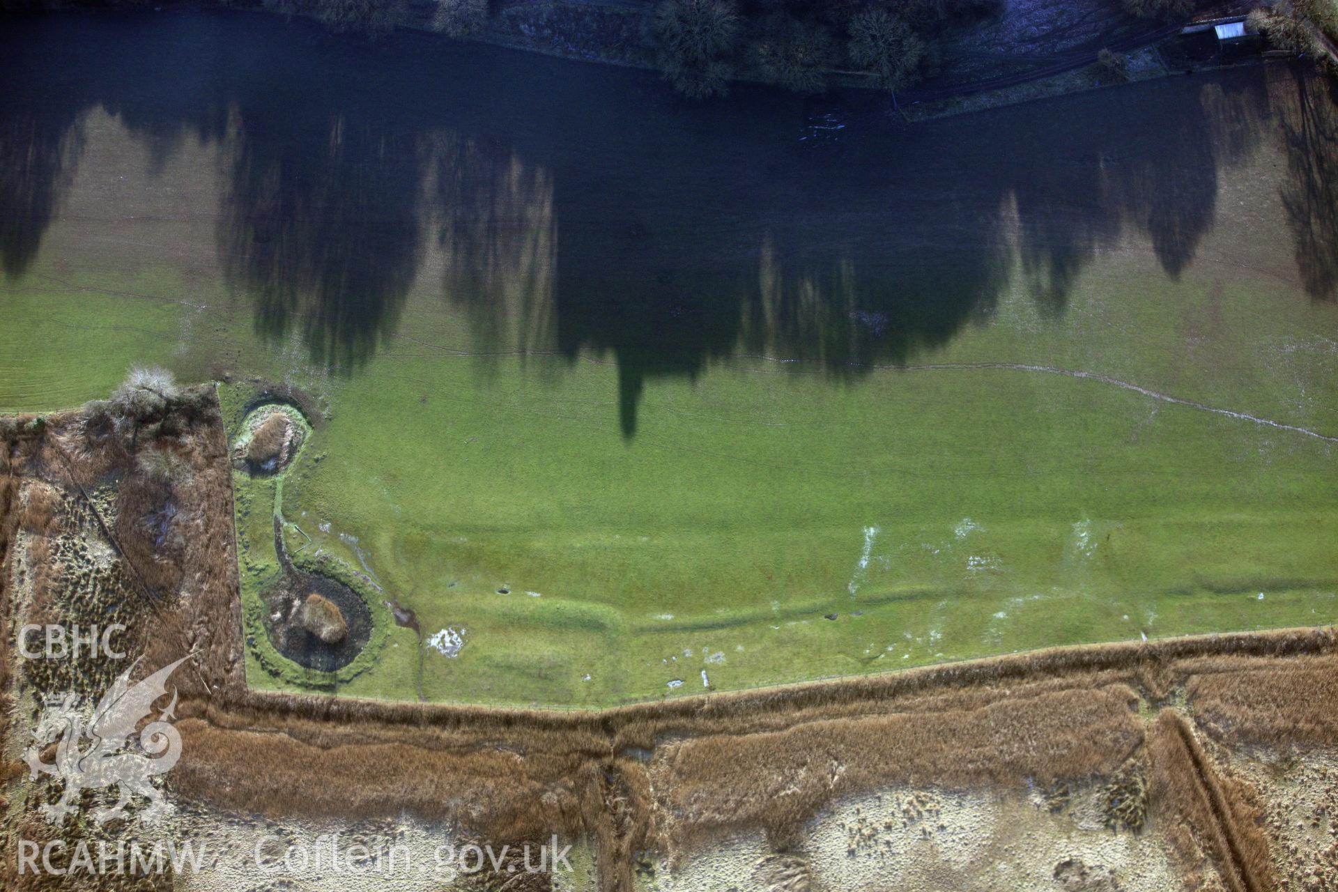 RCAHMW colour oblique photograph of Woebly Castle, Earthworks West Of Castle. Taken by Toby Driver on 02/02/2012.