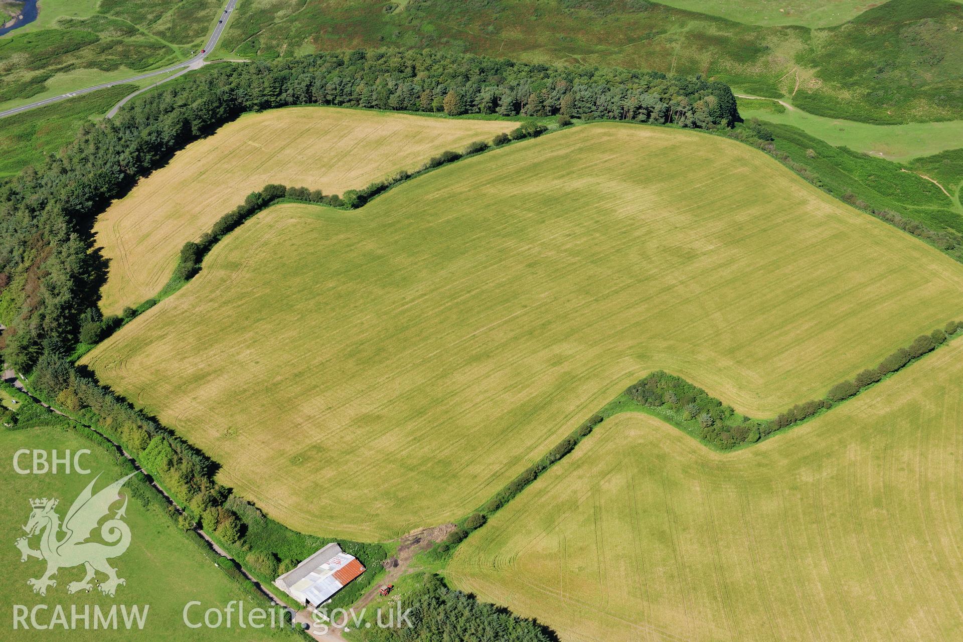 RCAHMW colour oblique photograph of Norton, causewayed enclosure, cropmarks. Taken by Toby Driver on 24/07/2012.