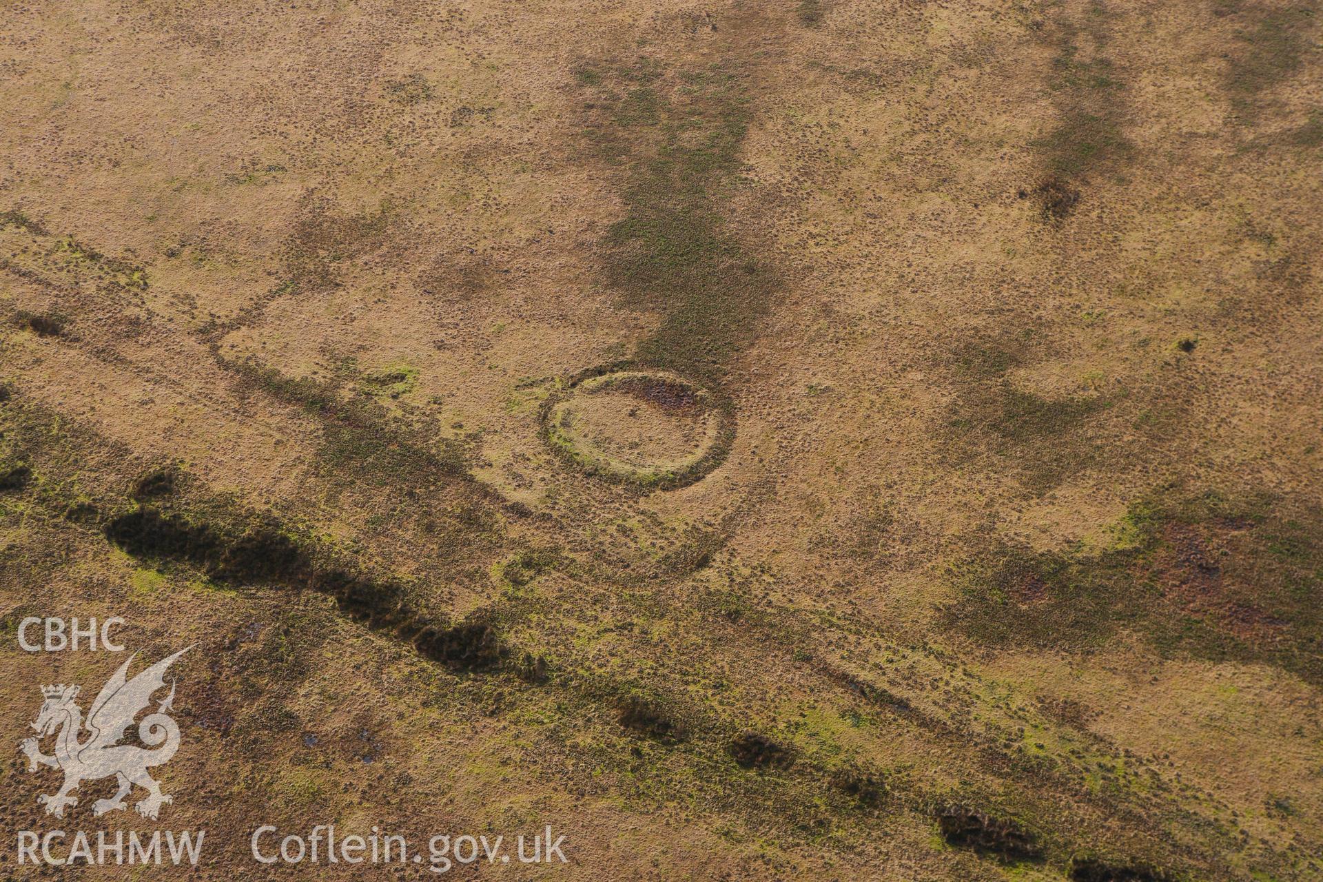 RCAHMW colour oblique photograph of Ring Cairn on Tor Clawdd. Taken by Toby Driver on 27/01/2012.