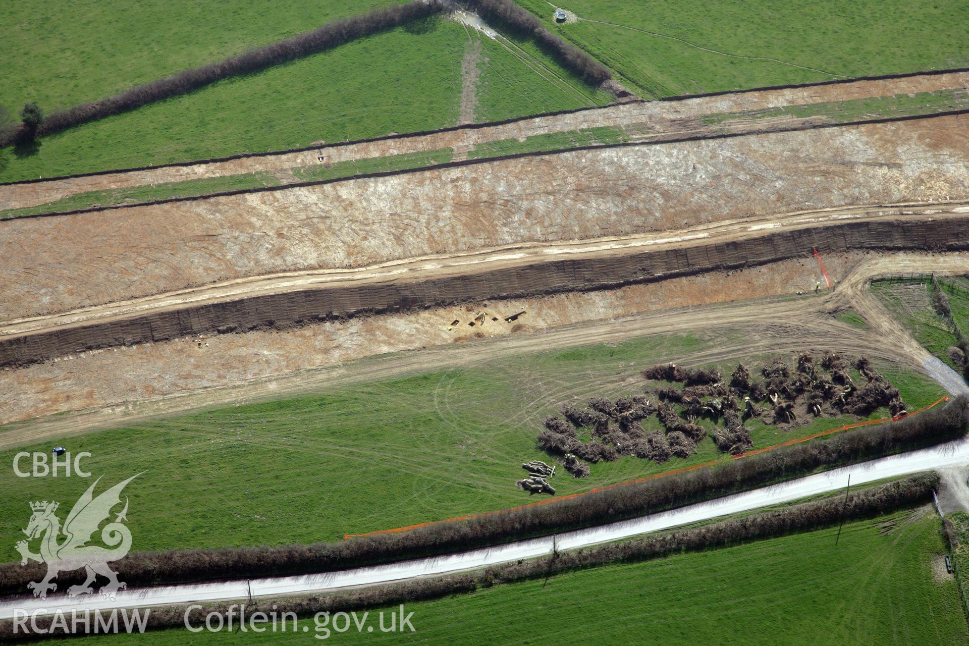 RCAHMW colour oblique photograph of A477 Bypass, at Pentrehowell. Archaeological excavations in progress. Taken by Toby Driver and Oliver Davies on 28/03/2012.