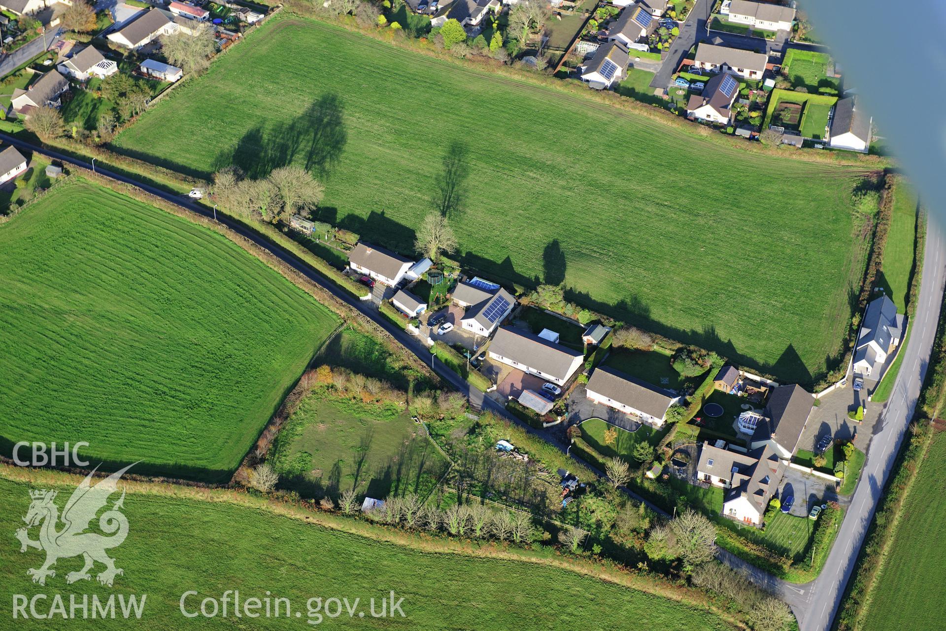 RCAHMW colour oblique photograph of Crug Swllt Round Barrow, Tavernspite. Taken by Toby Driver on 26/10/2012.