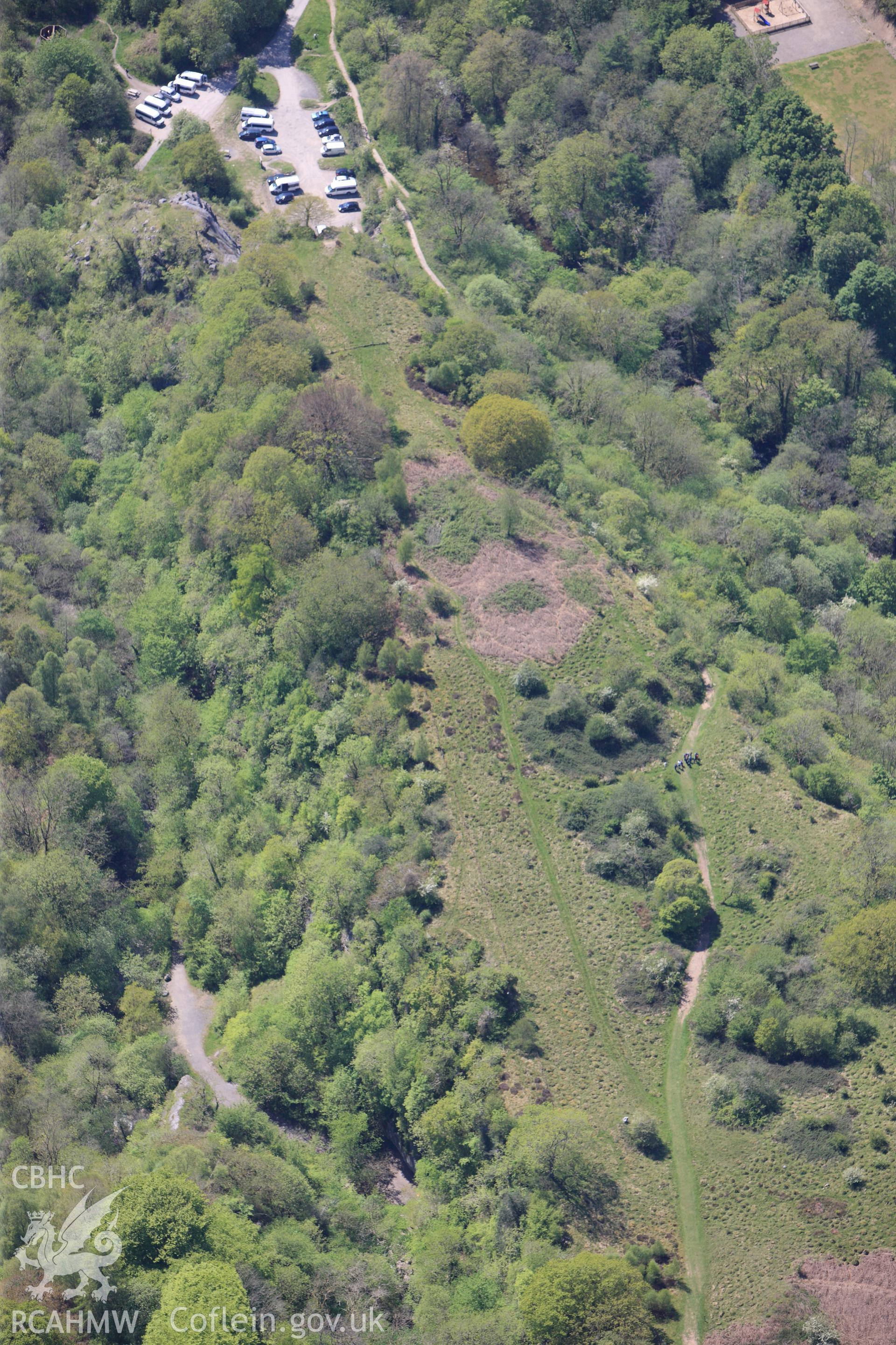 RCAHMW colour oblique photograph of Craig y Ddinas promontory fort, and Black Powder works, from north-east. Taken by Toby Driver on 22/05/2012.