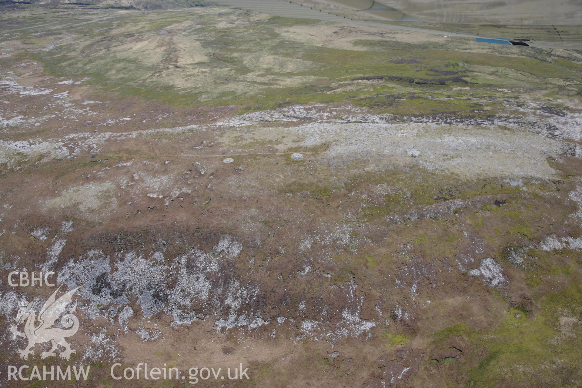 RCAHMW colour oblique photograph of Tair Carn Isaf, cairn cemetery, landscape view from north-west. Taken by Toby Driver on 22/05/2012.