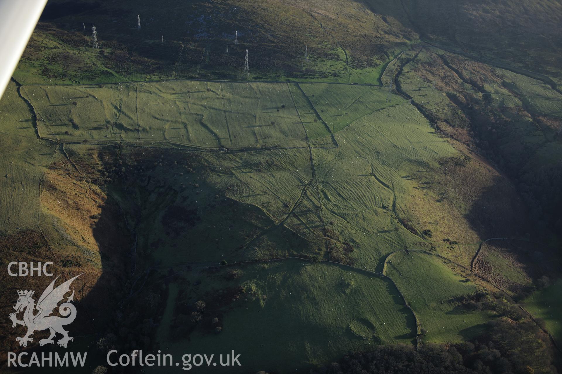 RCAHMW colour oblique photograph of Ffridd Ddu field system, and landscape. Taken by Toby Driver on 10/12/2012.