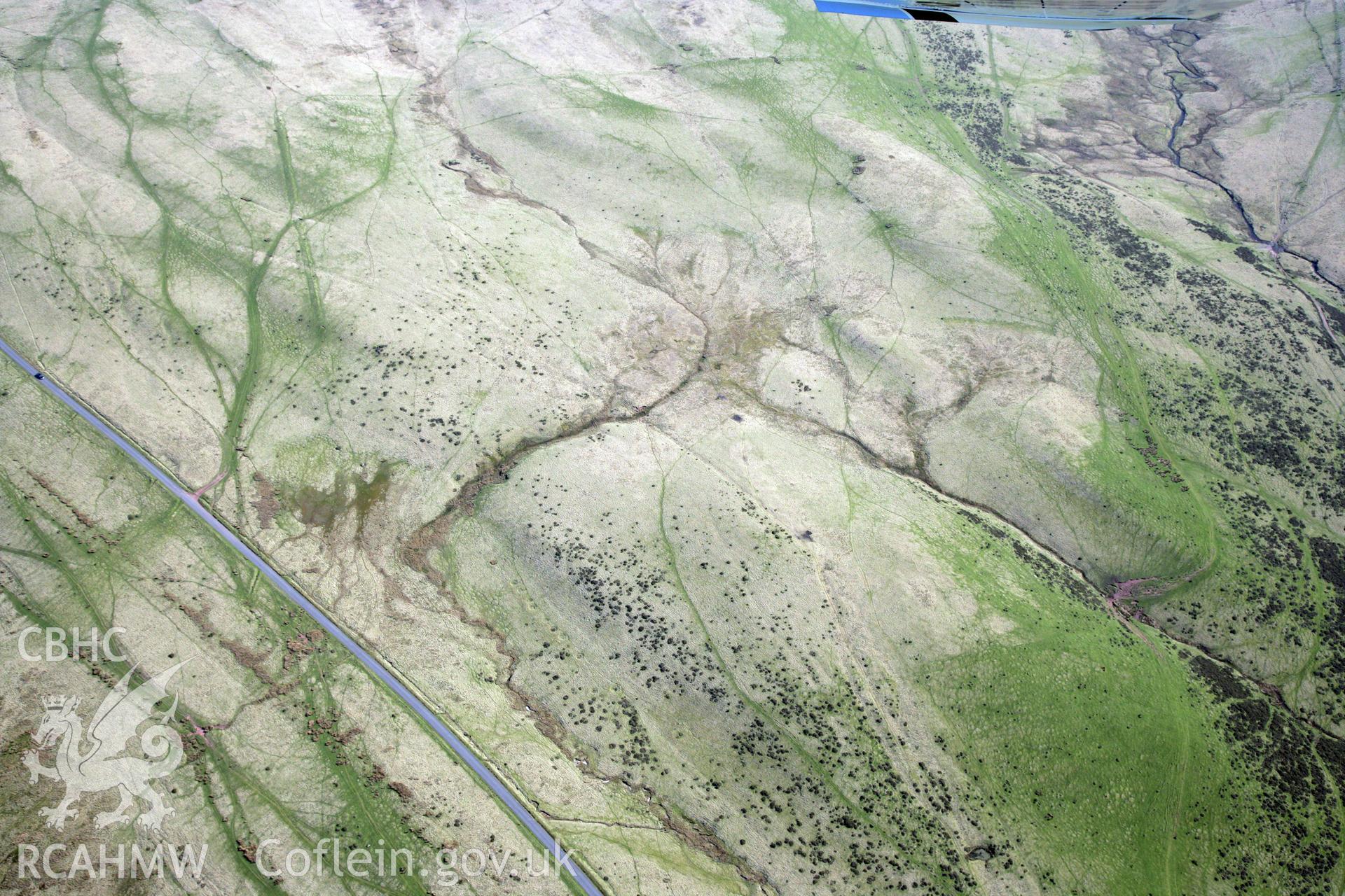 RCAHMW colour oblique photograph of Arhosfa'r Garreg Lwyd Roman marching camp. Taken by Toby Driver and Oliver Davies on 28/03/2012.