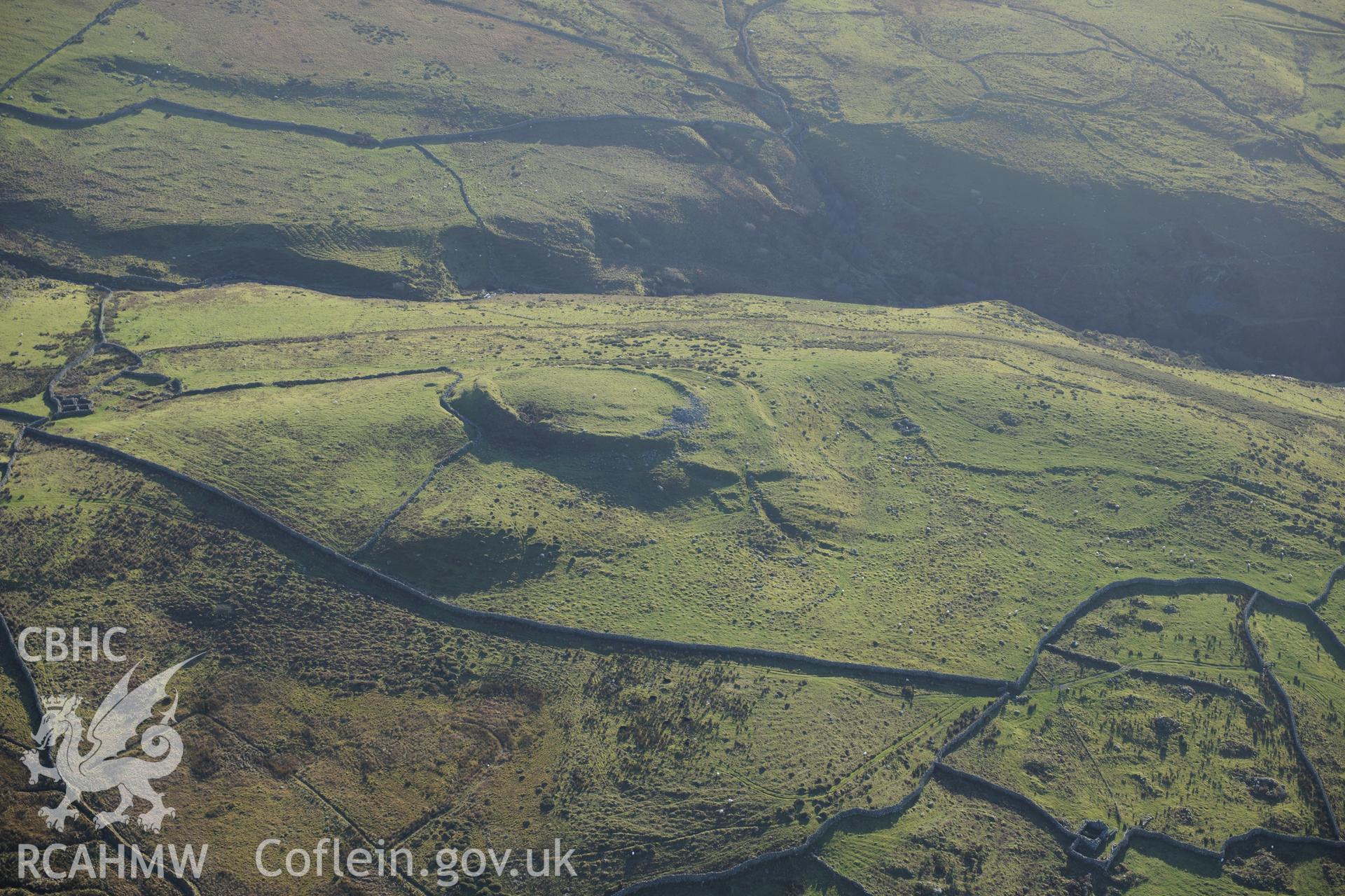 RCAHMW colour oblique photograph of Pen y Dinas, hillfort and upland landscape. Taken by Toby Driver on 10/12/2012.