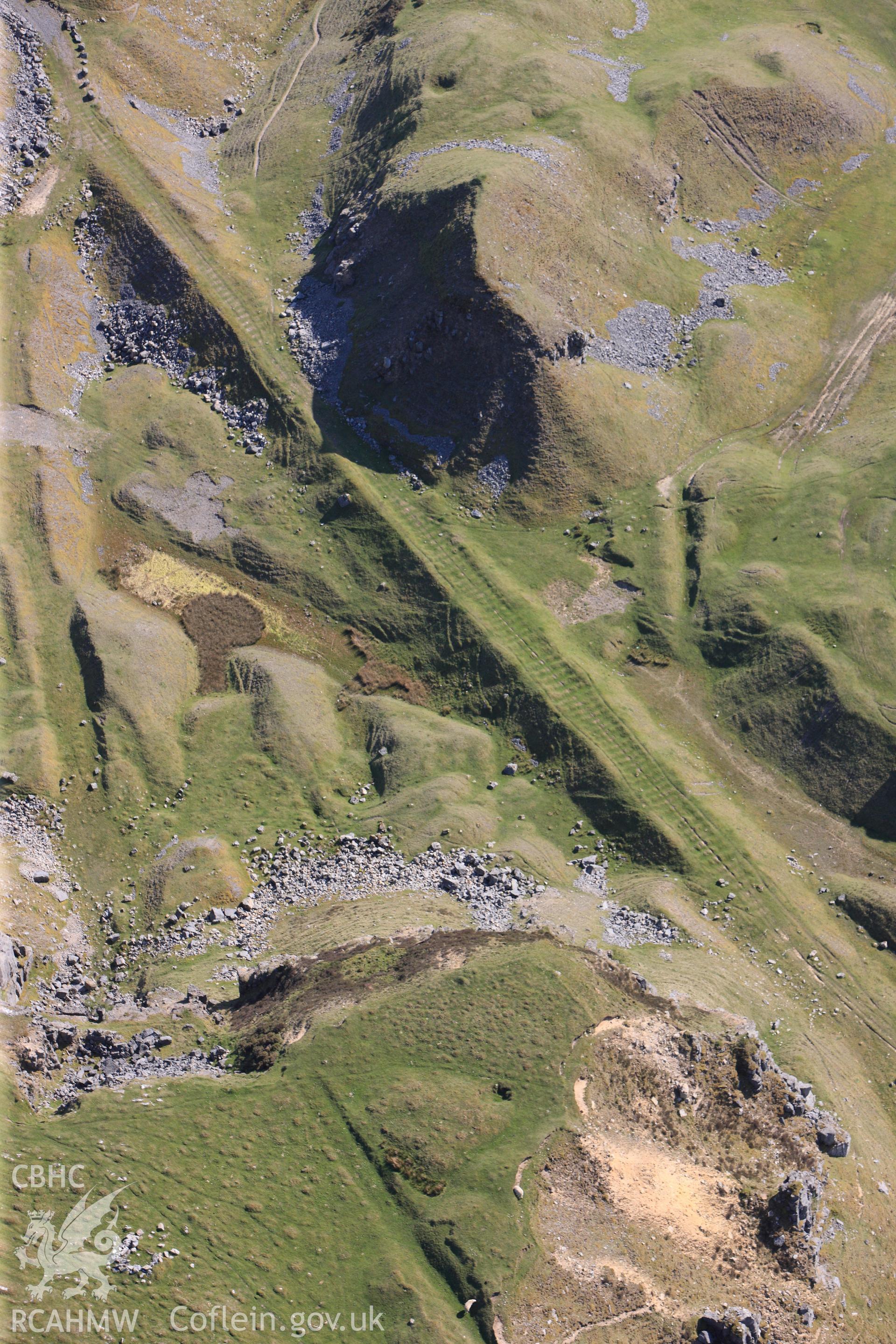 RCAHMW colour oblique photograph of Trefil Quarry, parchmarks of stone sleepers on tramroad. Taken by Toby Driver on 22/05/2012.