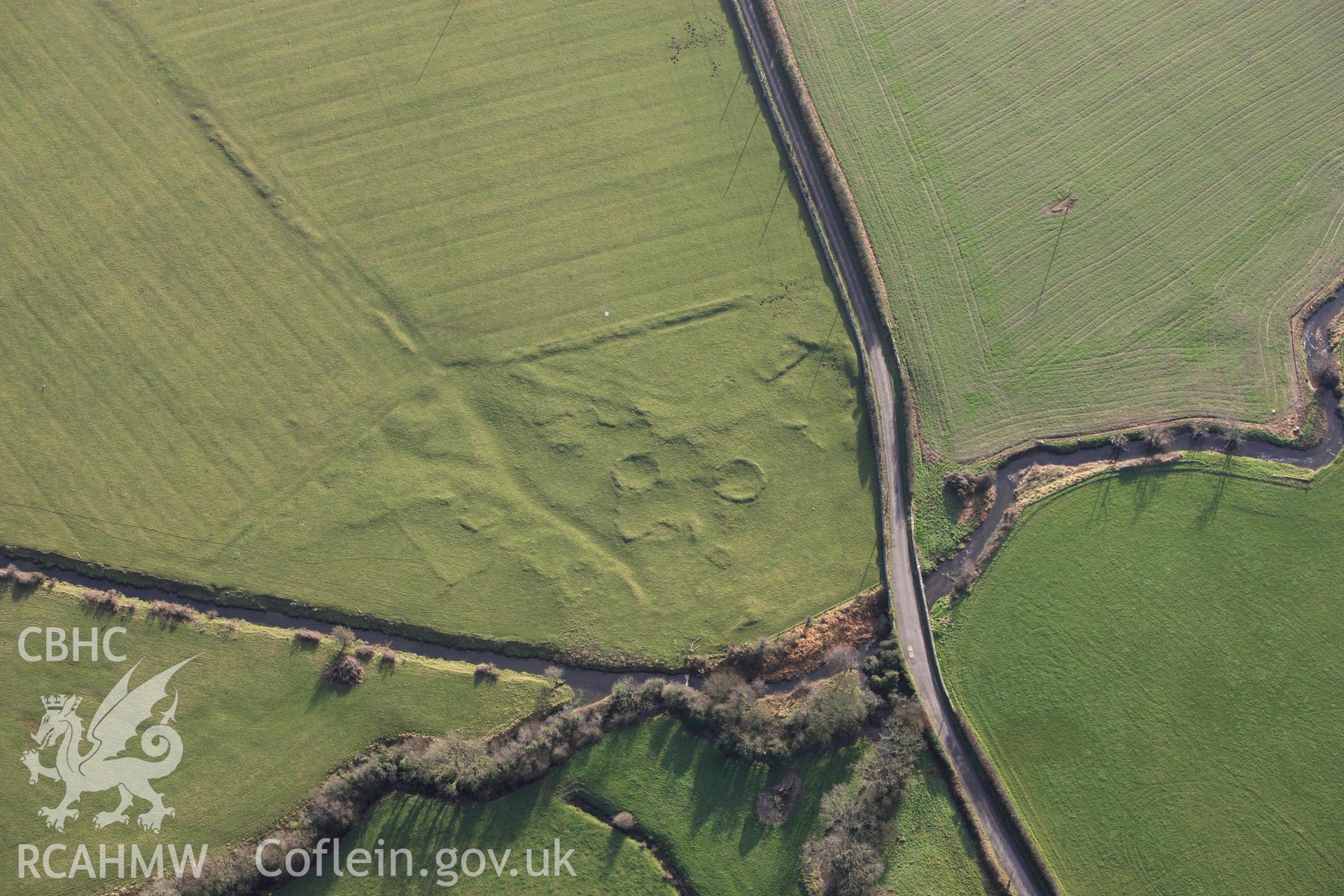 RCAHMW colour oblique photograph of Pont Sarn-las hut group, showing in low light. Taken by Toby Driver on 13/01/2012.