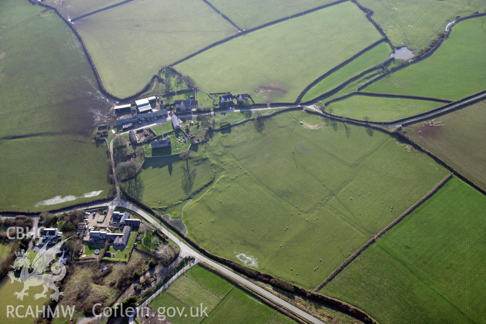 RCAHMW colour oblique photograph of Llanddewi Earthworks. Taken by Toby Driver on 02/02/2012.