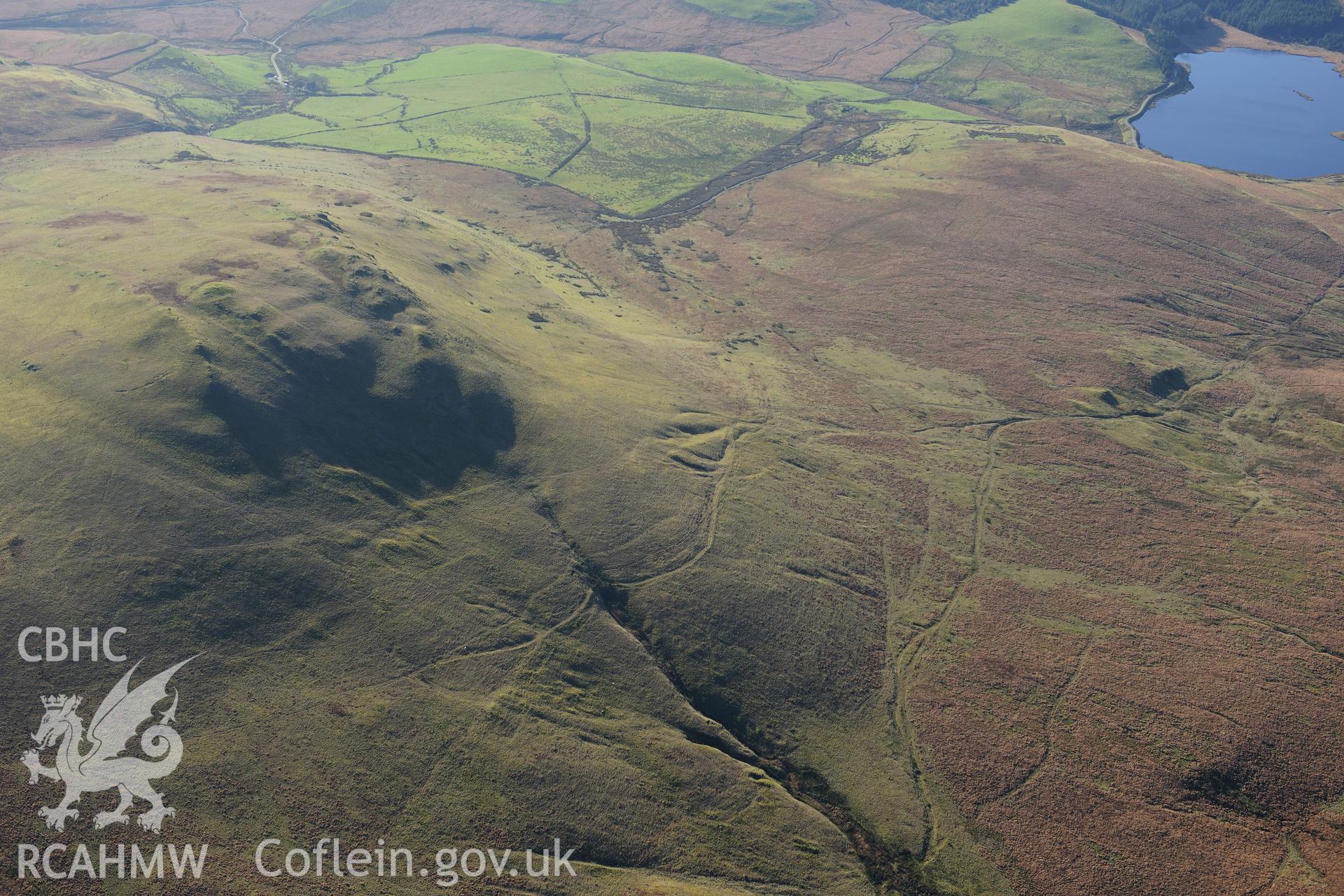 RCAHMW colour oblique photograph of Disgwylfa Fawr round barrow, braided tracks to west of. Taken by Toby Driver on 05/11/2012.