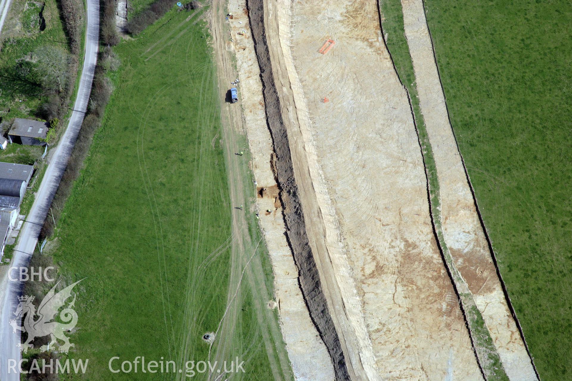 RCAHMW colour oblique photograph of A477 Bypass, at Pentrehowell. Archaeological excavations in progress. Taken by Toby Driver and Oliver Davies on 28/03/2012.