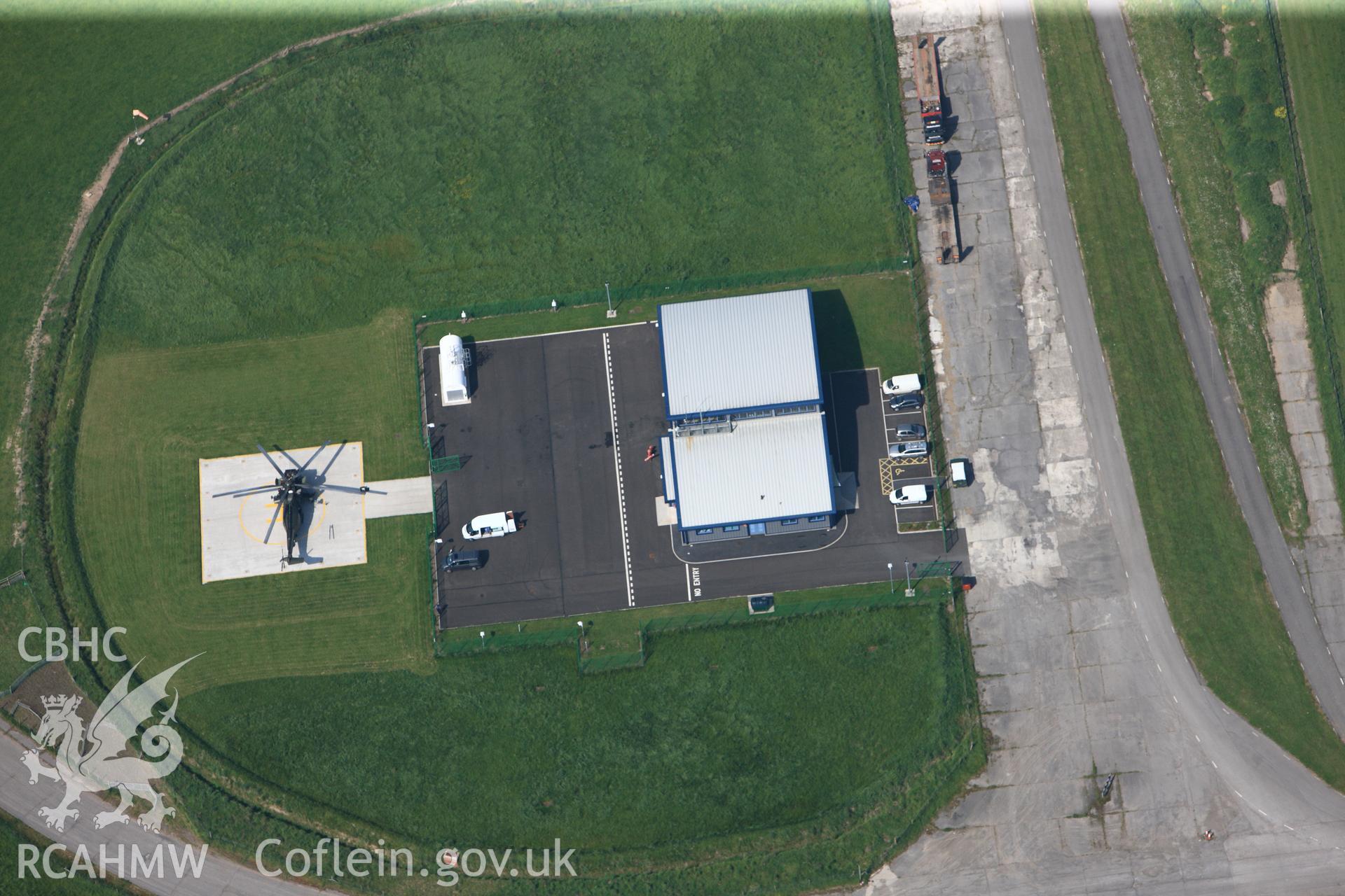 RCAHMW colour oblique photograph of General view of helicopter pad at Pembrey airfield, looking south west. Taken by Toby Driver on 24/05/2012.