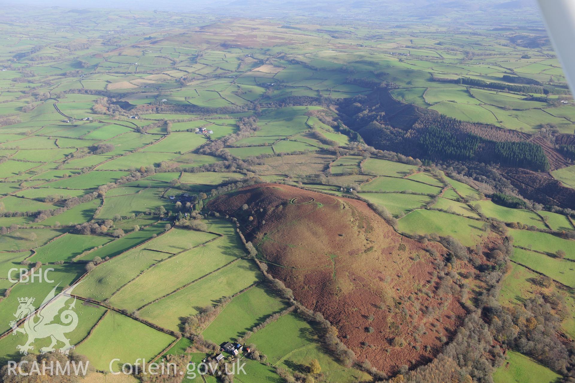 RCAHMW colour oblique photograph of Twyn y Garth defended enclosure, wide landscape view. Taken by Toby Driver on 23/11/2012.