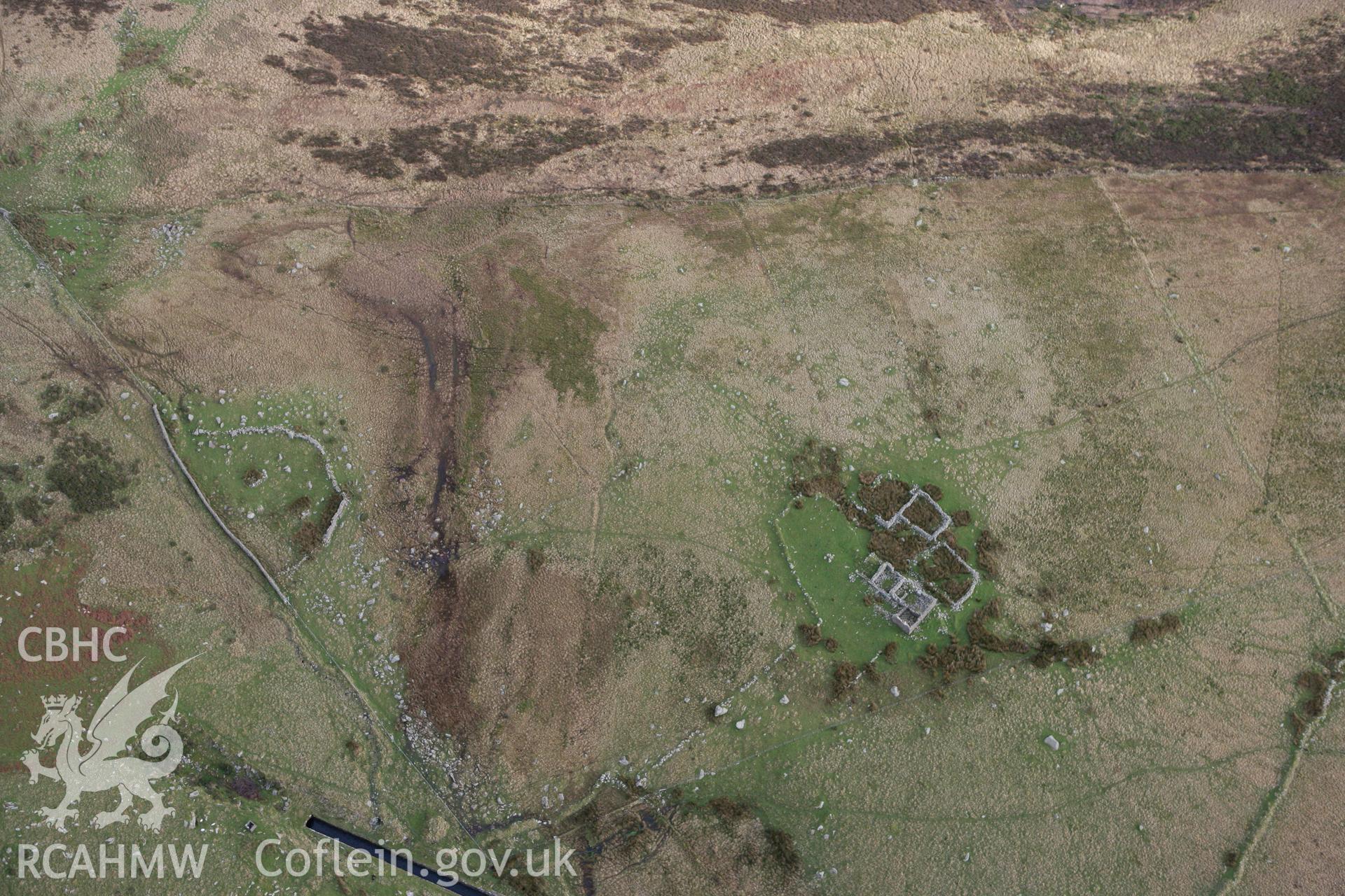 RCAHMW colour oblique photograph of Ty'n Rhos farmstead, ruins. Taken by Toby Driver on 13/01/2012.