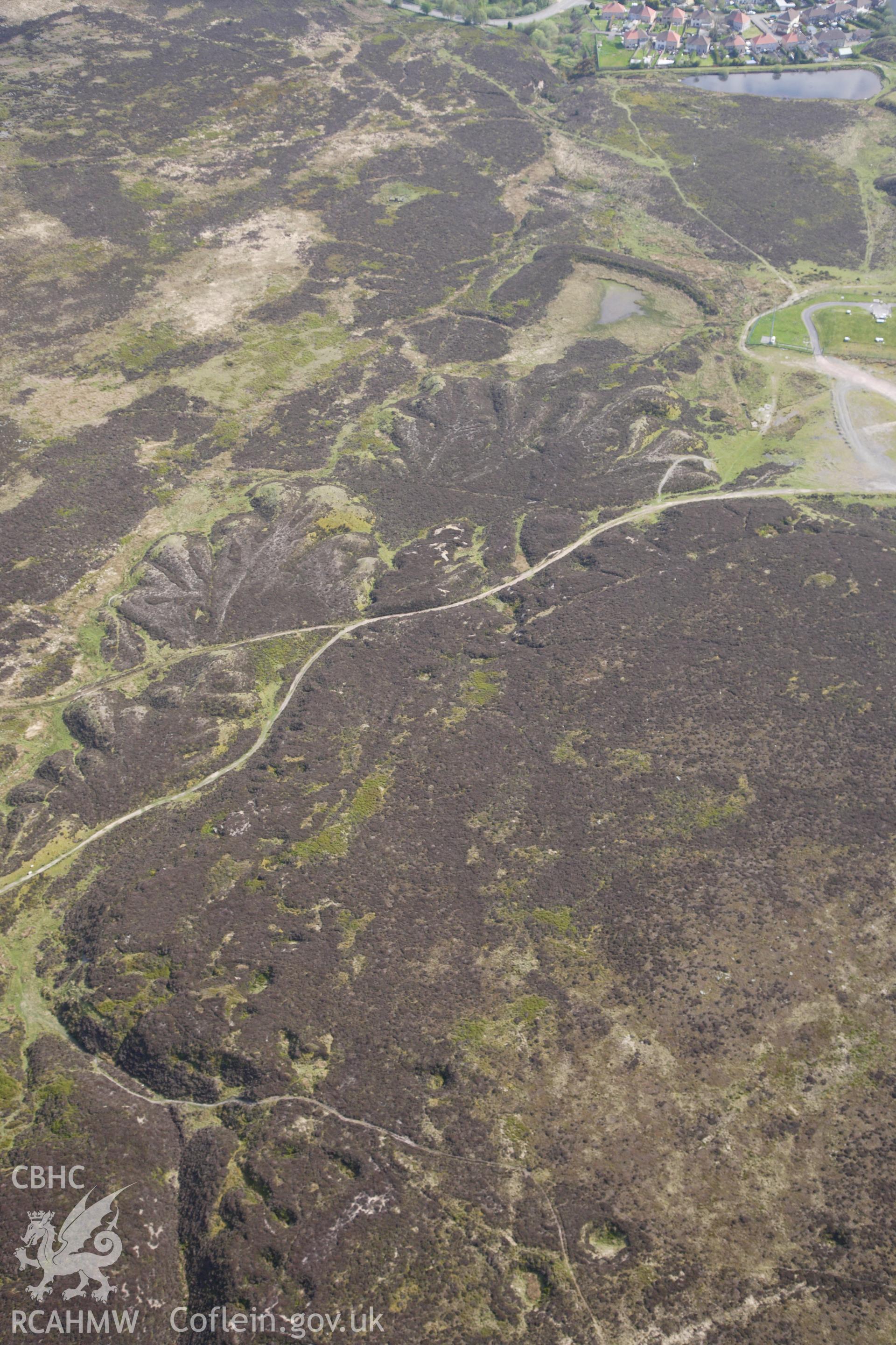 RCAHMW colour oblique photograph of Pen-ffordd-goch iron and coal workings and patching. Taken by Toby Driver on 22/05/2012.