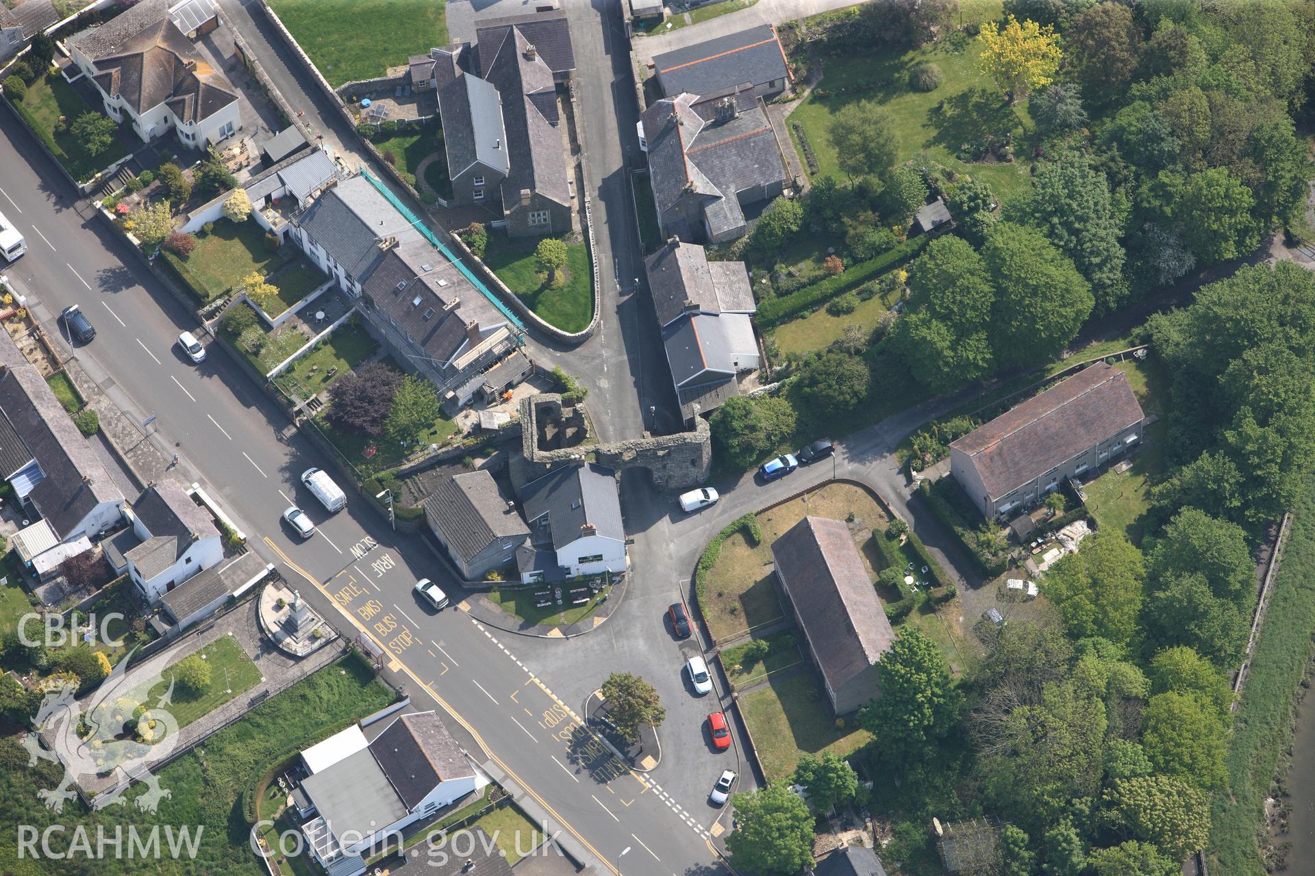 RCAHMW colour oblique photograph of General view of Kidwelly town gatehouse, looking east. Taken by Toby Driver on 24/05/2012.