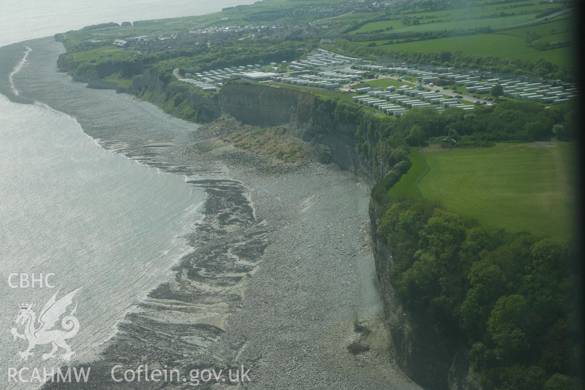 RCAHMW colour oblique photograph of The Bulwarks Camp, with recent cliff collapse at Porthkerry Caravan Park. Taken by Toby Driver on 22/05/2012.