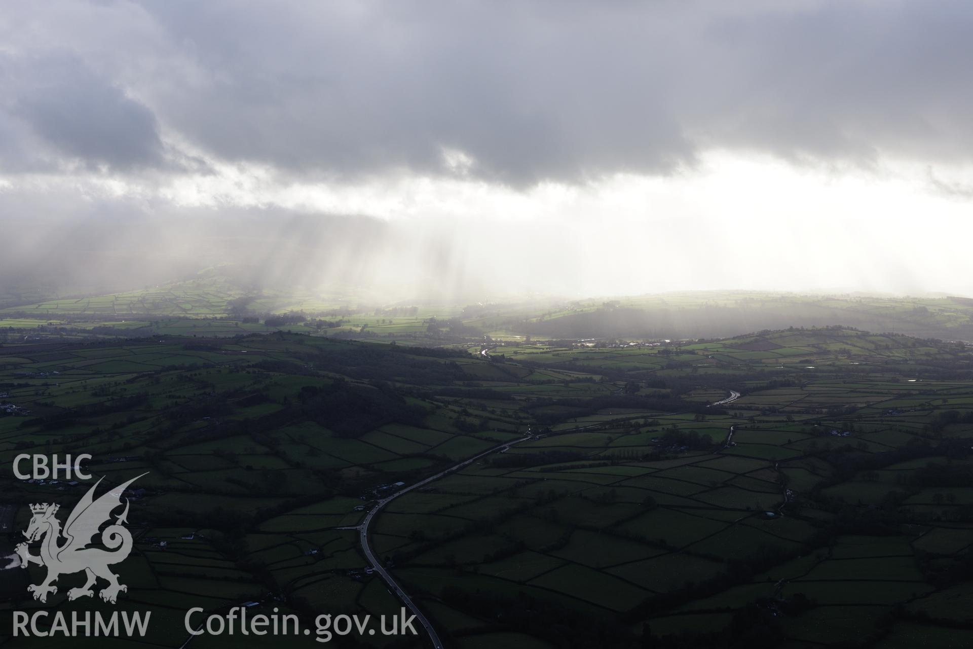 RCAHMW colour oblique photograph of Llanddew, distant landscape view from north-east. Taken by Toby Driver on 23/11/2012.