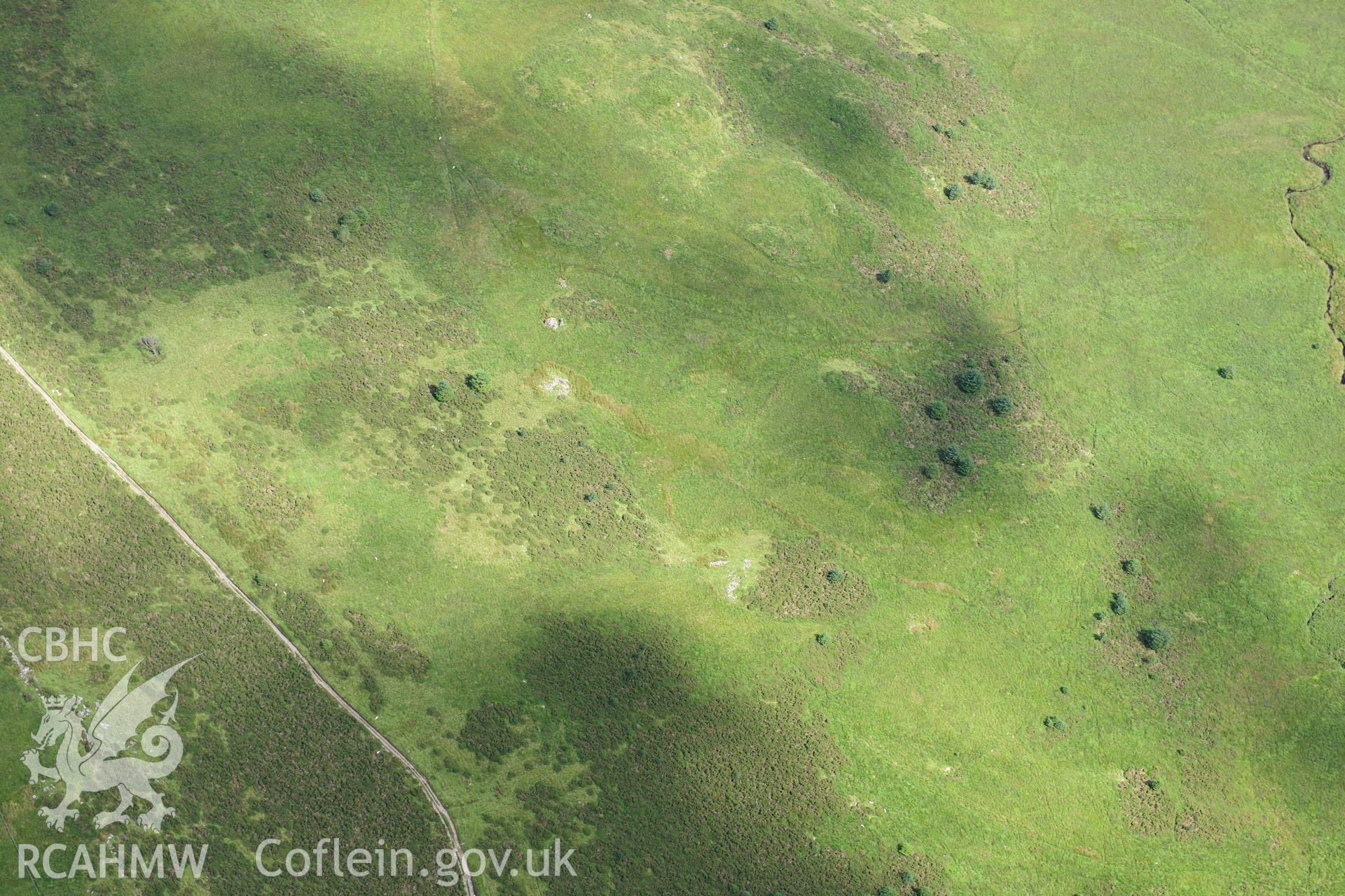 RCAHMW colour oblique photograph of two cairns, Cefn-glas, viewed from the north-west. Taken by Toby Driver on 10/08/2012.