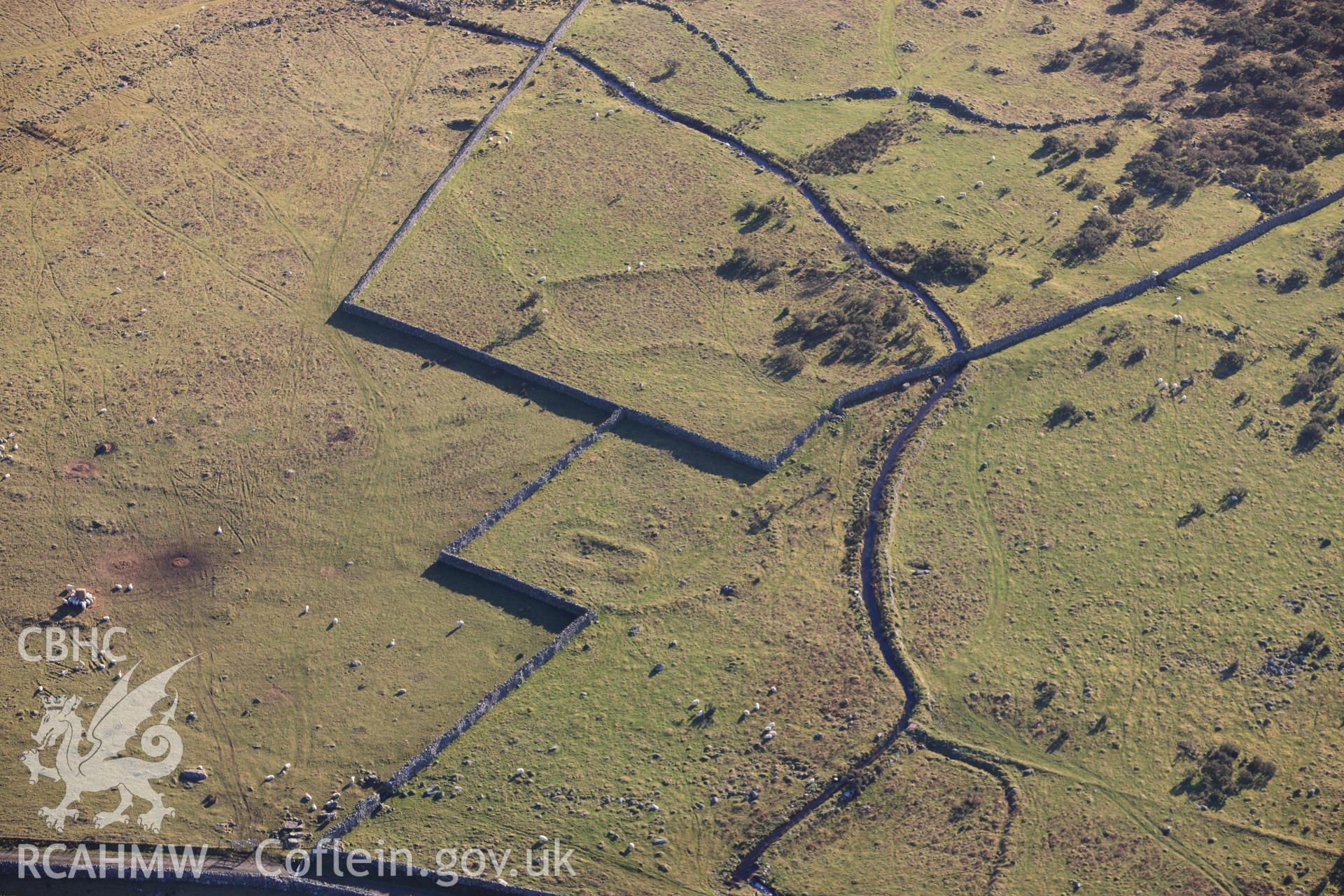 RCAHMW colour oblique photograph of Cors y Gedol field system, long house and field systems. Taken by Toby Driver on 10/12/2012.