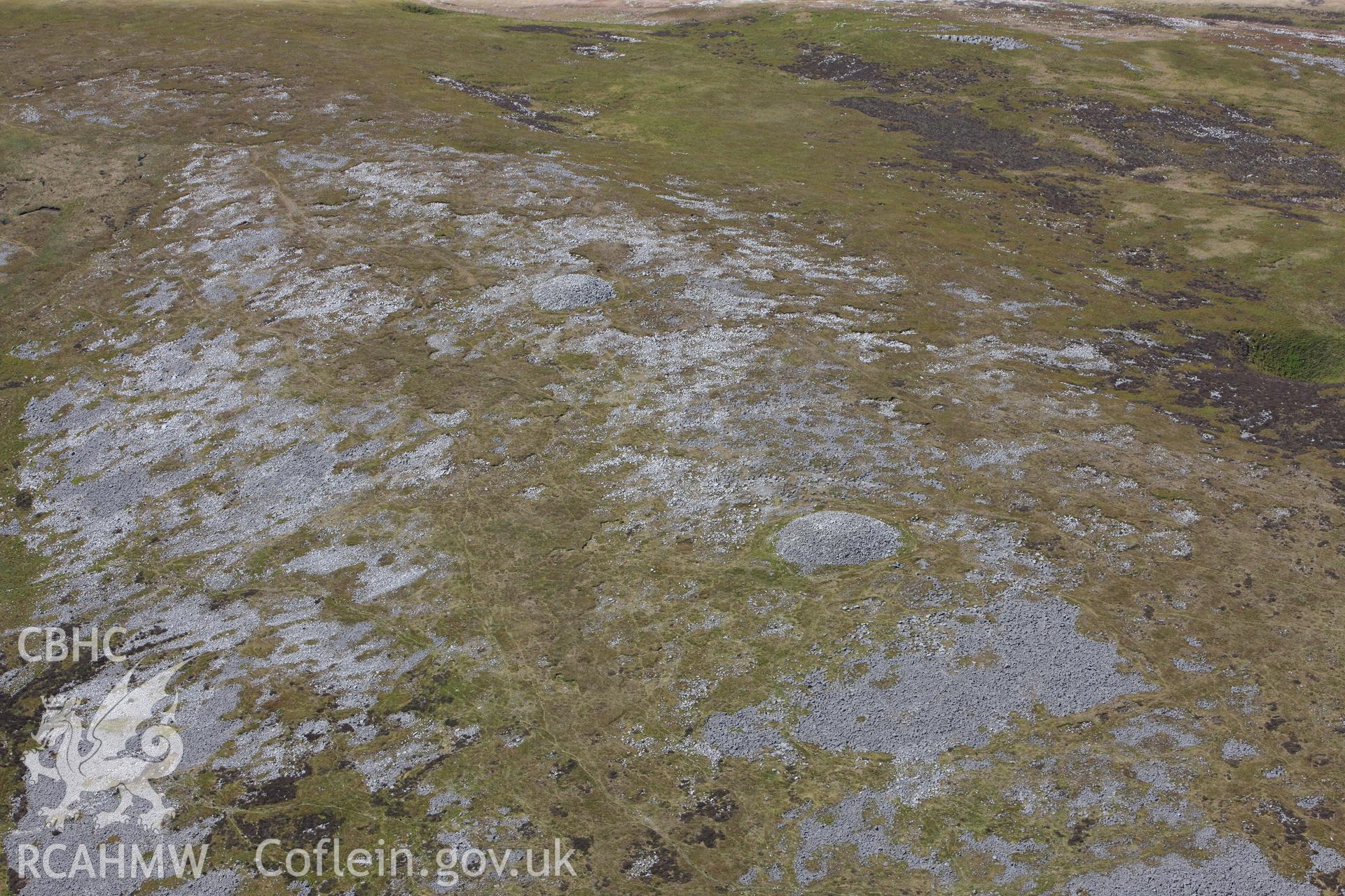 RCAHMW colour oblique photograph of Tair Carn Uchaf cairns, view from east. Taken by Toby Driver on 22/05/2012.