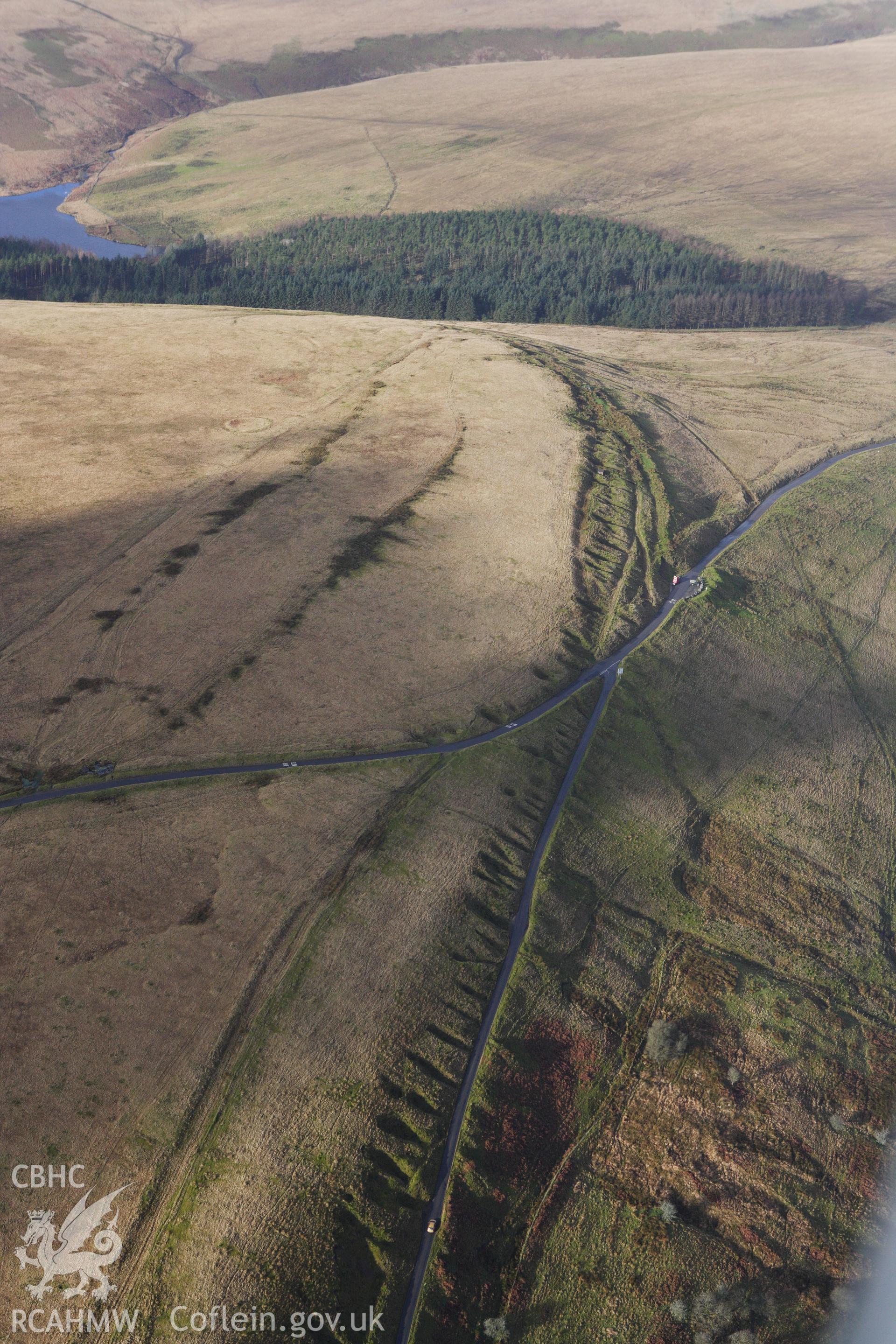 RCAHMW colour oblique photograph of Ring Cairn on Tor Clawdd, with Tor Clawdd Causeway. Taken by Toby Driver on 27/01/2012.