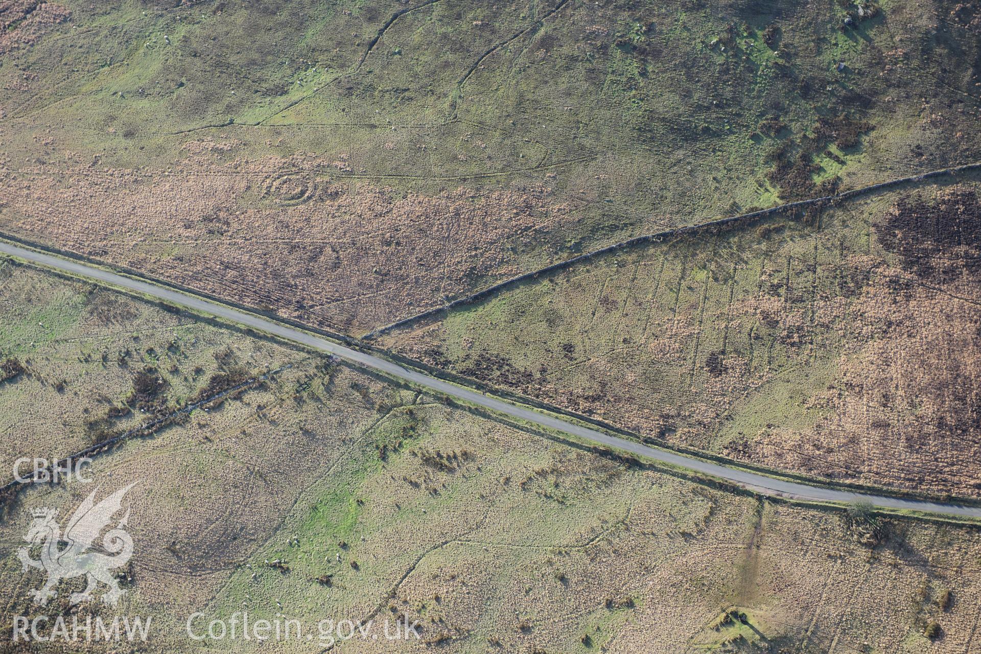 RCAHMW colour oblique photograph of Llech-Llia, multi-banked ring barrow. Taken by Toby Driver on 28/11/2012.