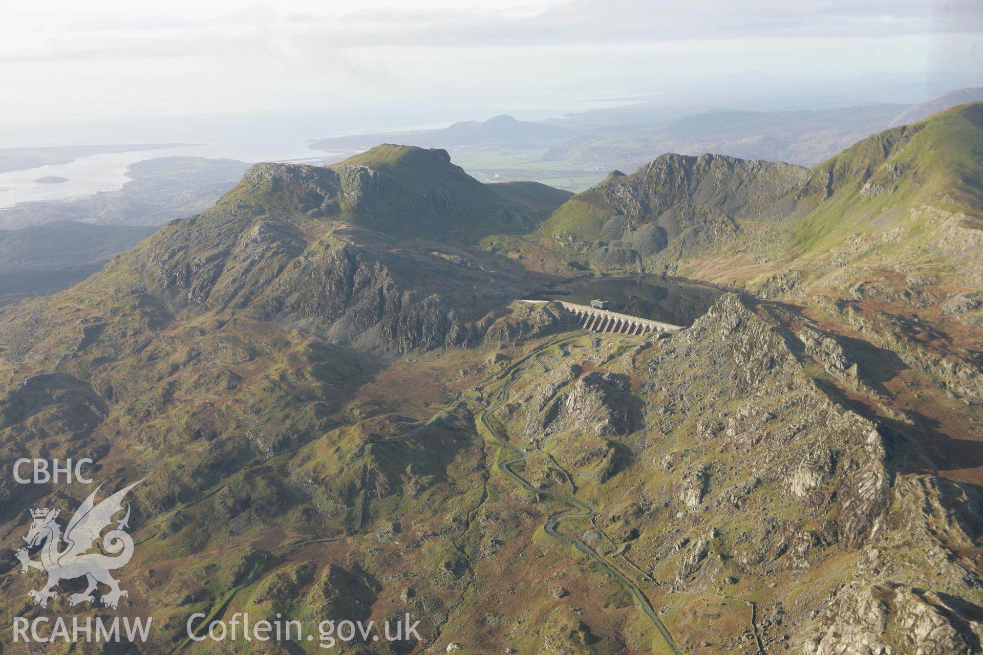 RCAHMW colour oblique photograph of Llyn Stwlan reservoir, with Moelwyn slate quarry. Taken by Toby Driver on 13/01/2012.