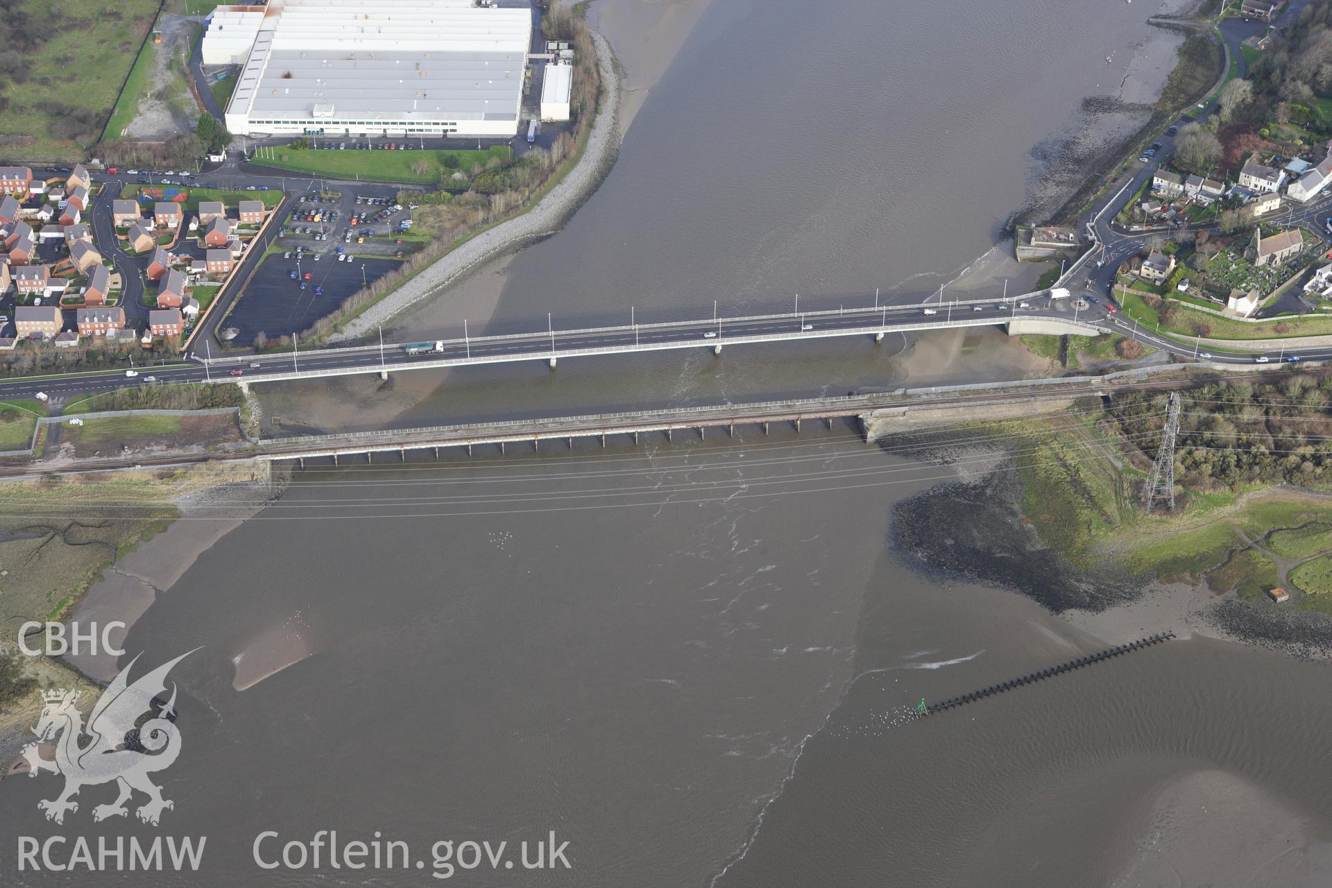 RCAHMW colour oblique photograph of Loughor Railway Viaduct, with St. Michael's Church. Taken by Toby Driver on 27/01/2012.