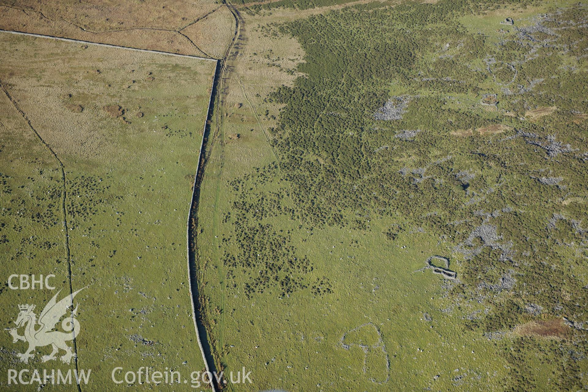 RCAHMW colour oblique photograph of Hut group and enclosures on south-west slopes of Moelfre. Taken by Toby Driver on 10/12/2012.