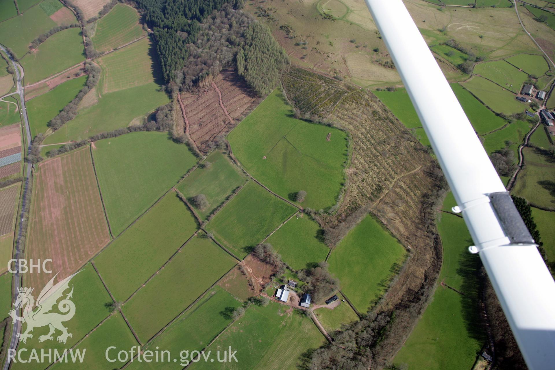 RCAHMW colour oblique photograph of Penpont-fach, denuded hillfort west of Twyn y Gaer hillfort. Taken by Toby Driver and Oliver Davies on 28/03/2012.