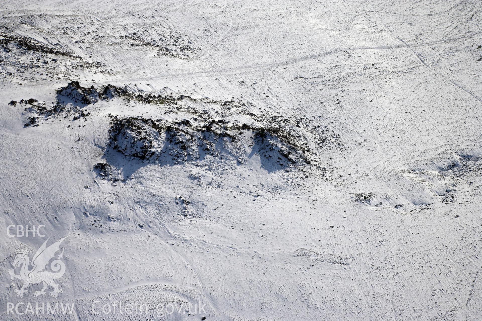 RCAHMW colour oblique photograph of Carn Meini Bluestone Outcrops of Spotted Dolerite. Taken by Toby Driver on 02/02/2012.