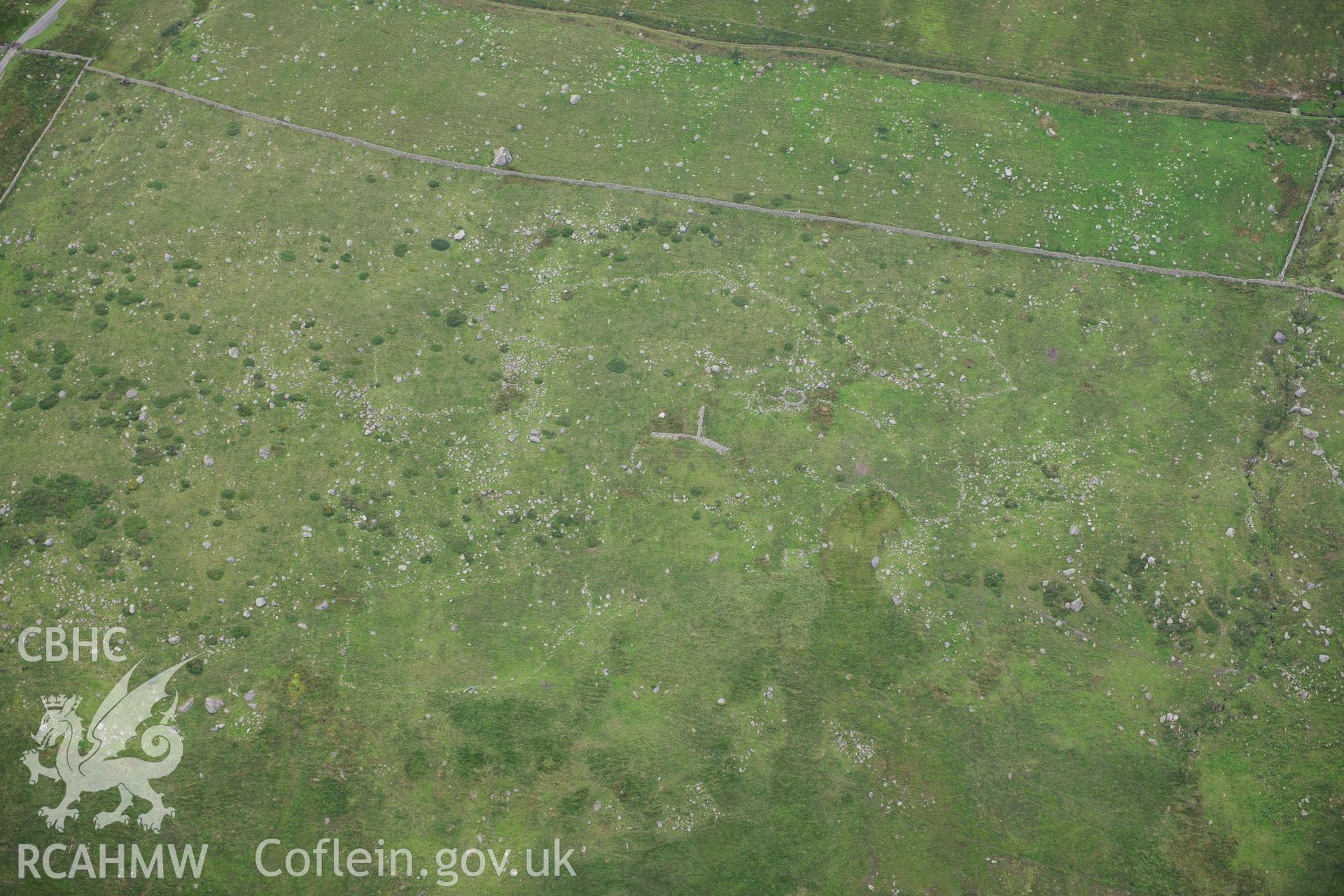 RCAHMW colour oblique photograph of hut circle settlement, viewed from the south. Taken by Toby Driver on 10/08/2012.