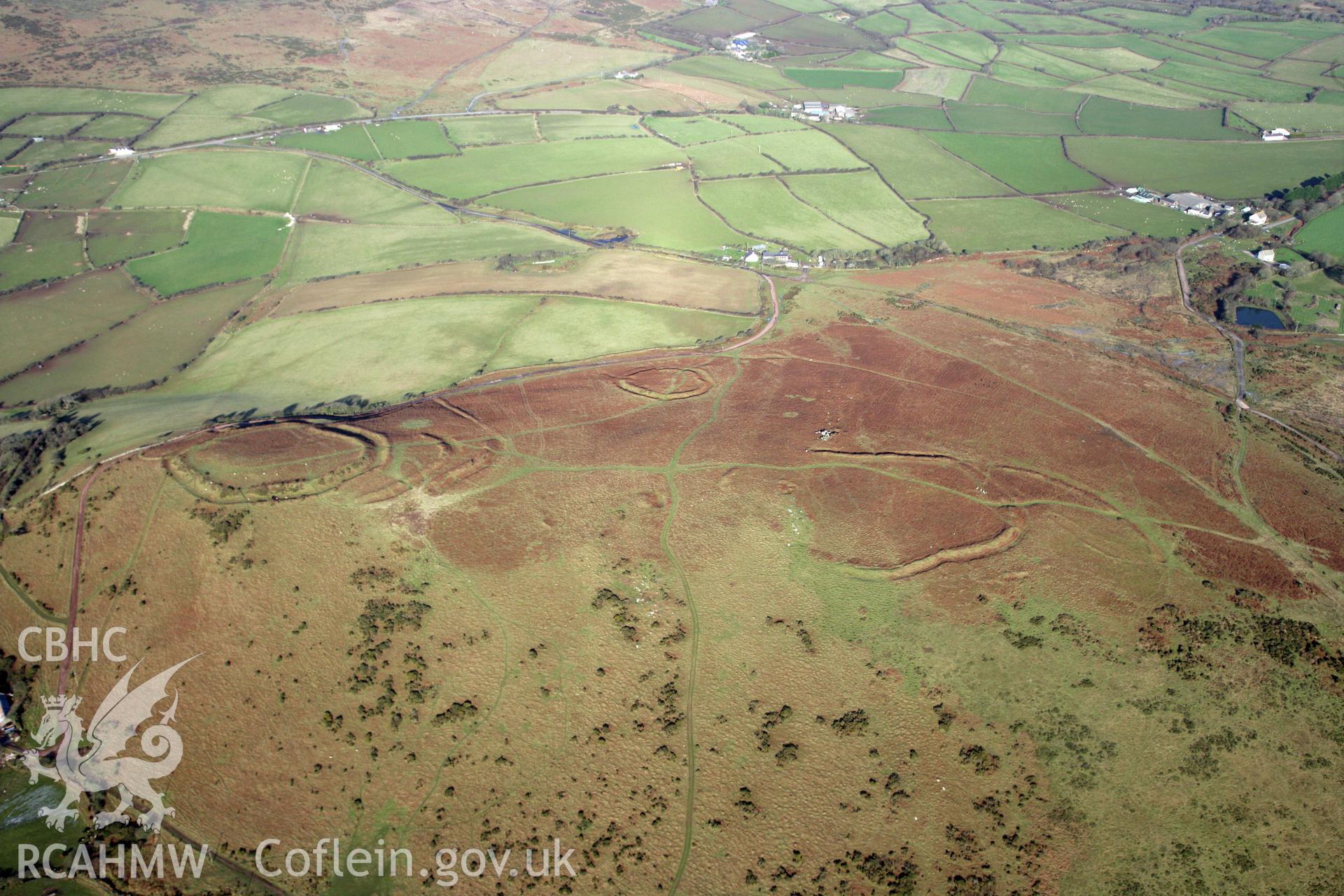 RCAHMW colour oblique photograph of Three Camps On Hardings Down. Taken by Toby Driver on 02/02/2012.