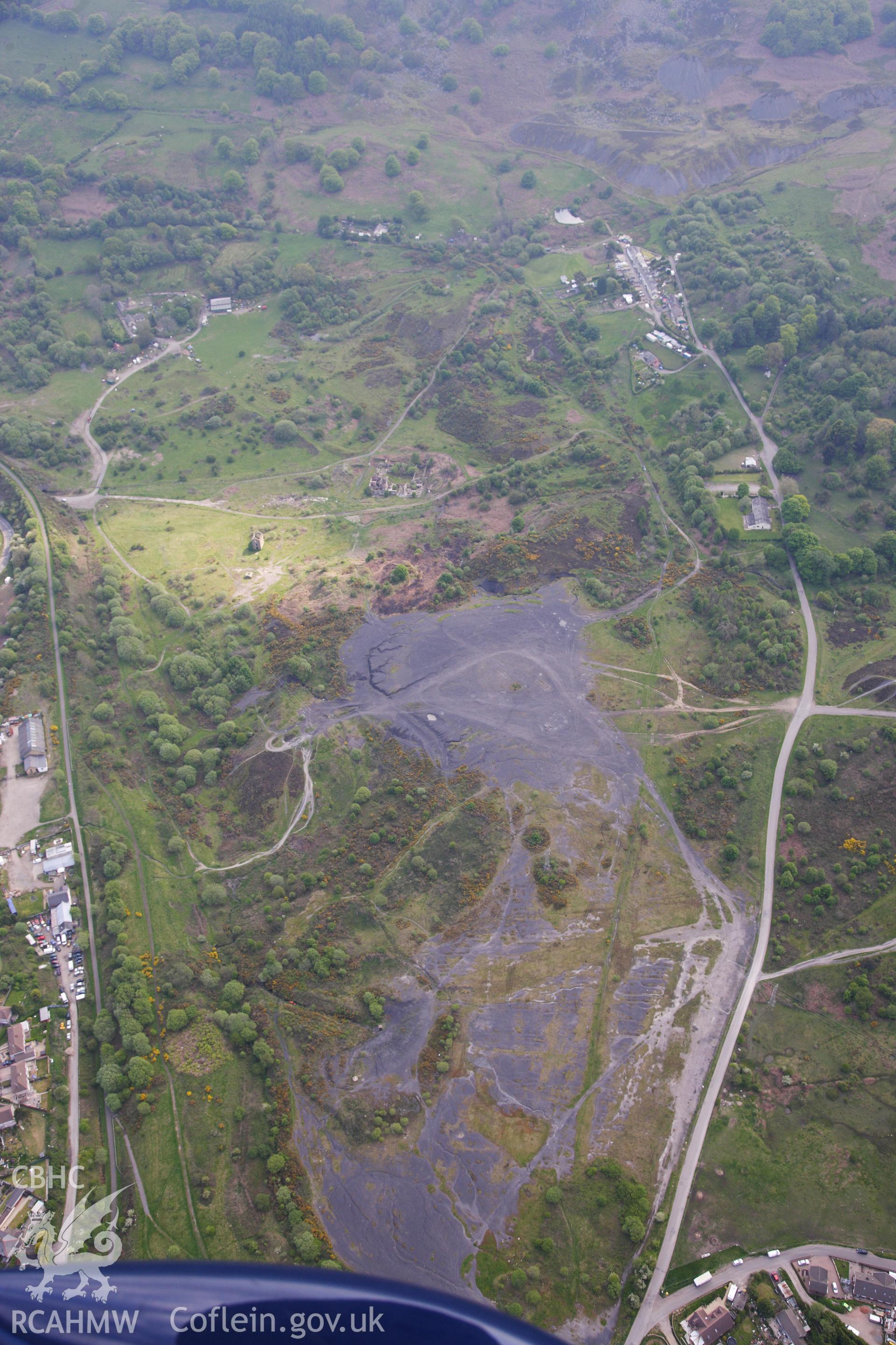 RCAHMW colour oblique photograph of British Ironworks, view from north with spoil tips. Taken by Toby Driver on 22/05/2012.