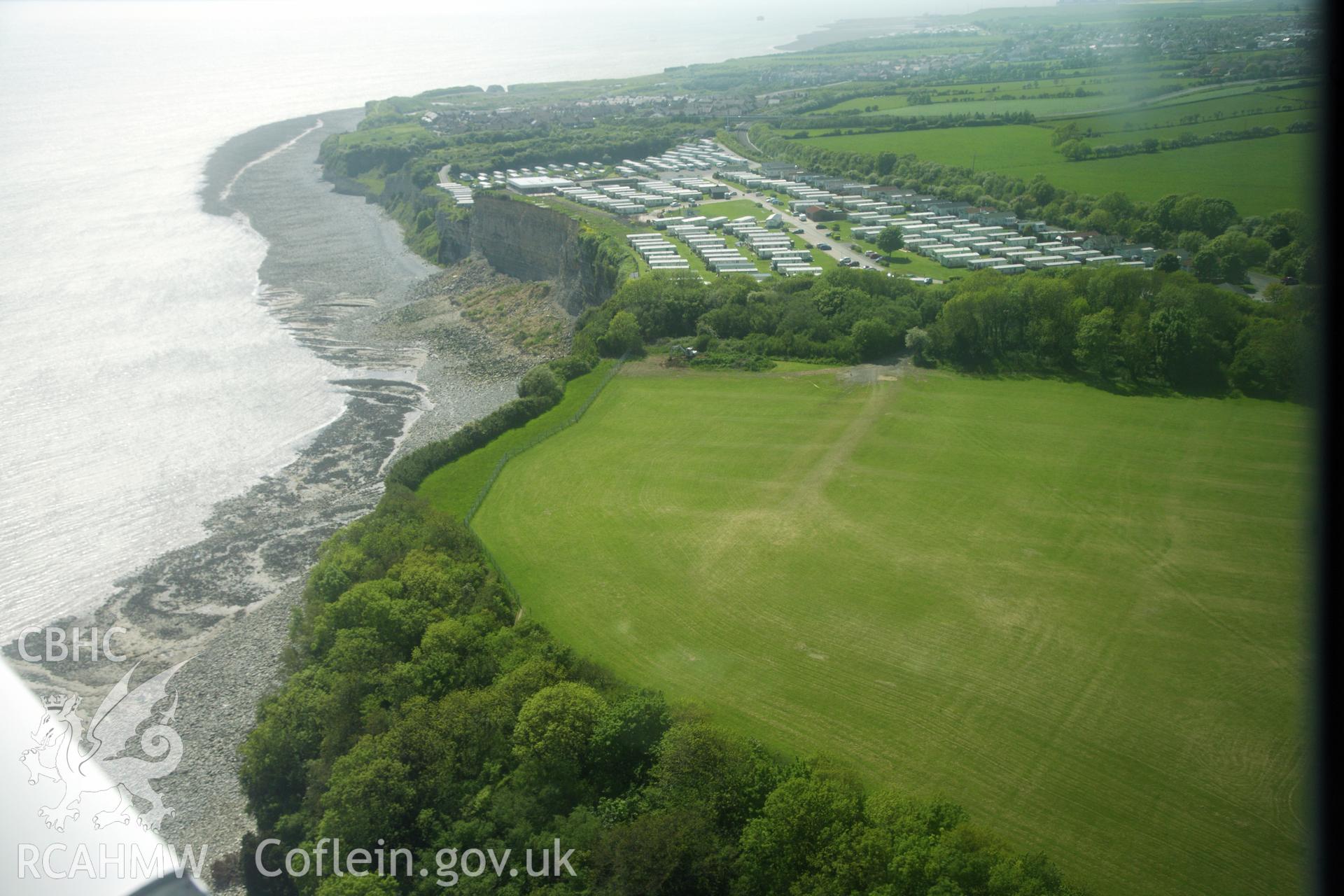 RCAHMW colour oblique photograph of The Bulwarks Camp, with recent cliff collapse at Porthkerry Caravan Park. Taken by Toby Driver on 22/05/2012.