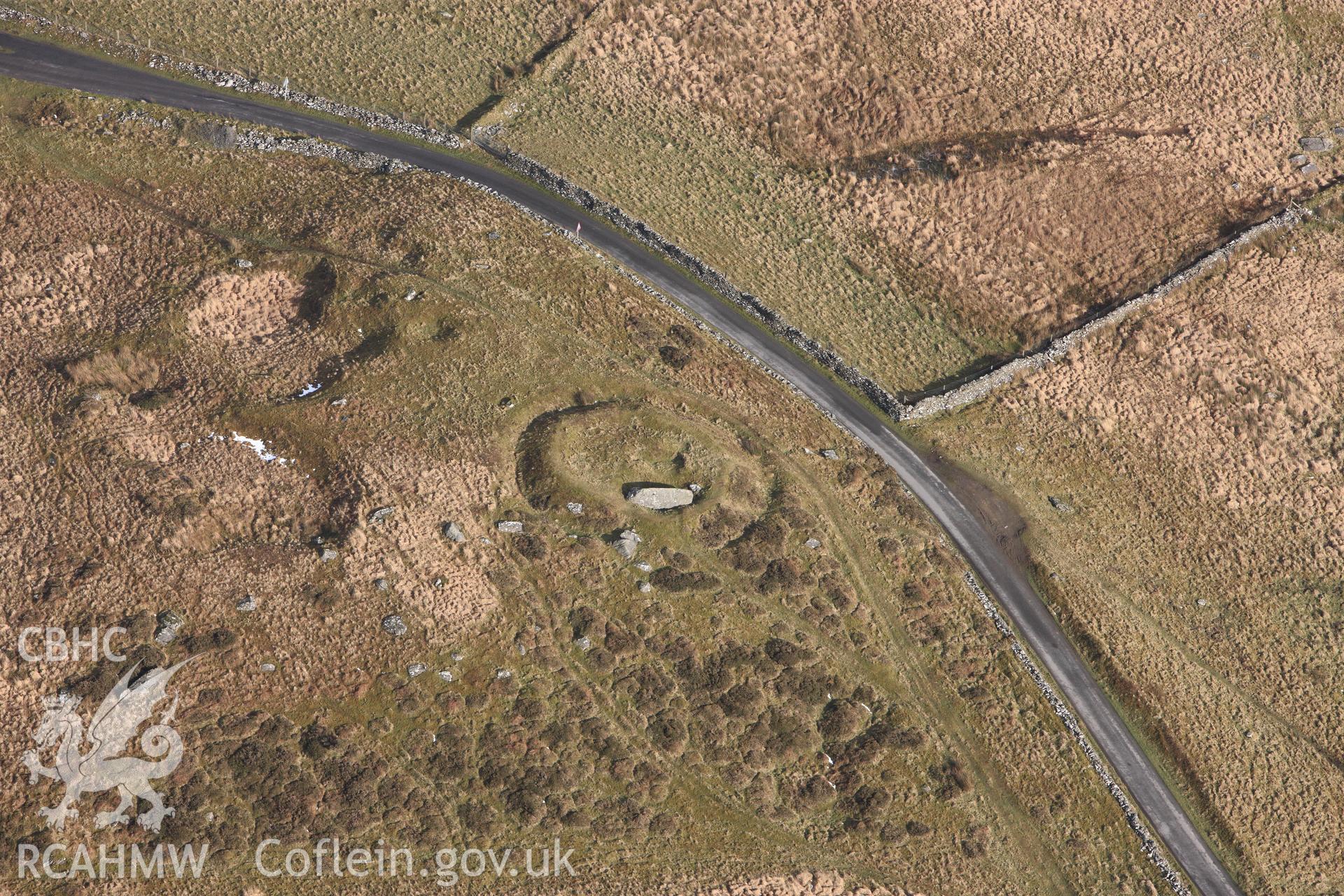 RCAHMW colour oblique photograph of Carreg-Y-Bwci Round Barrow and Roman Signal Station. Taken by Toby Driver on 07/02/2012.