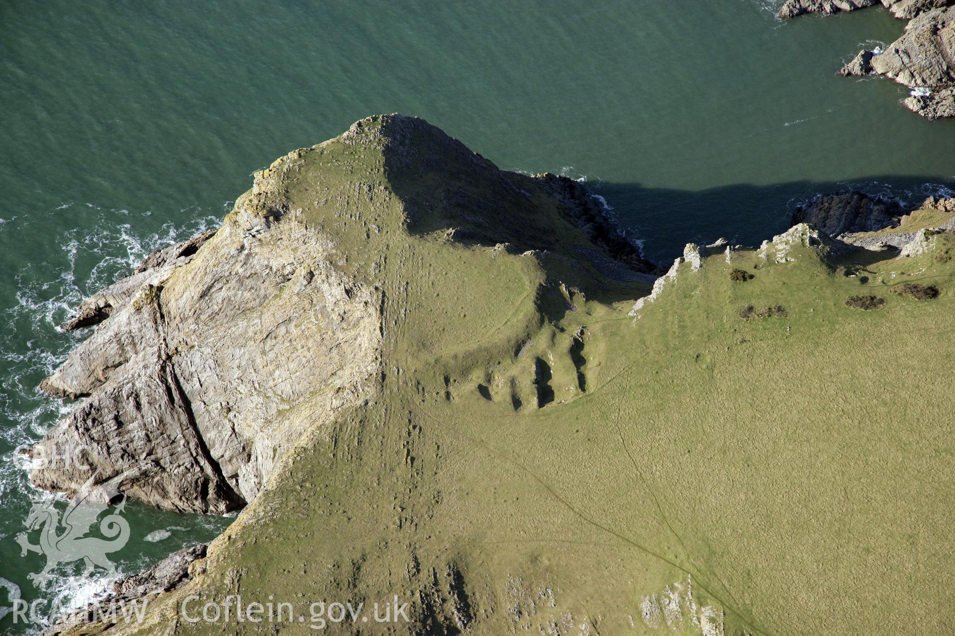 RCAHMW colour oblique photograph of Horsecliff Promontry Fort. Taken by Toby Driver on 02/02/2012.