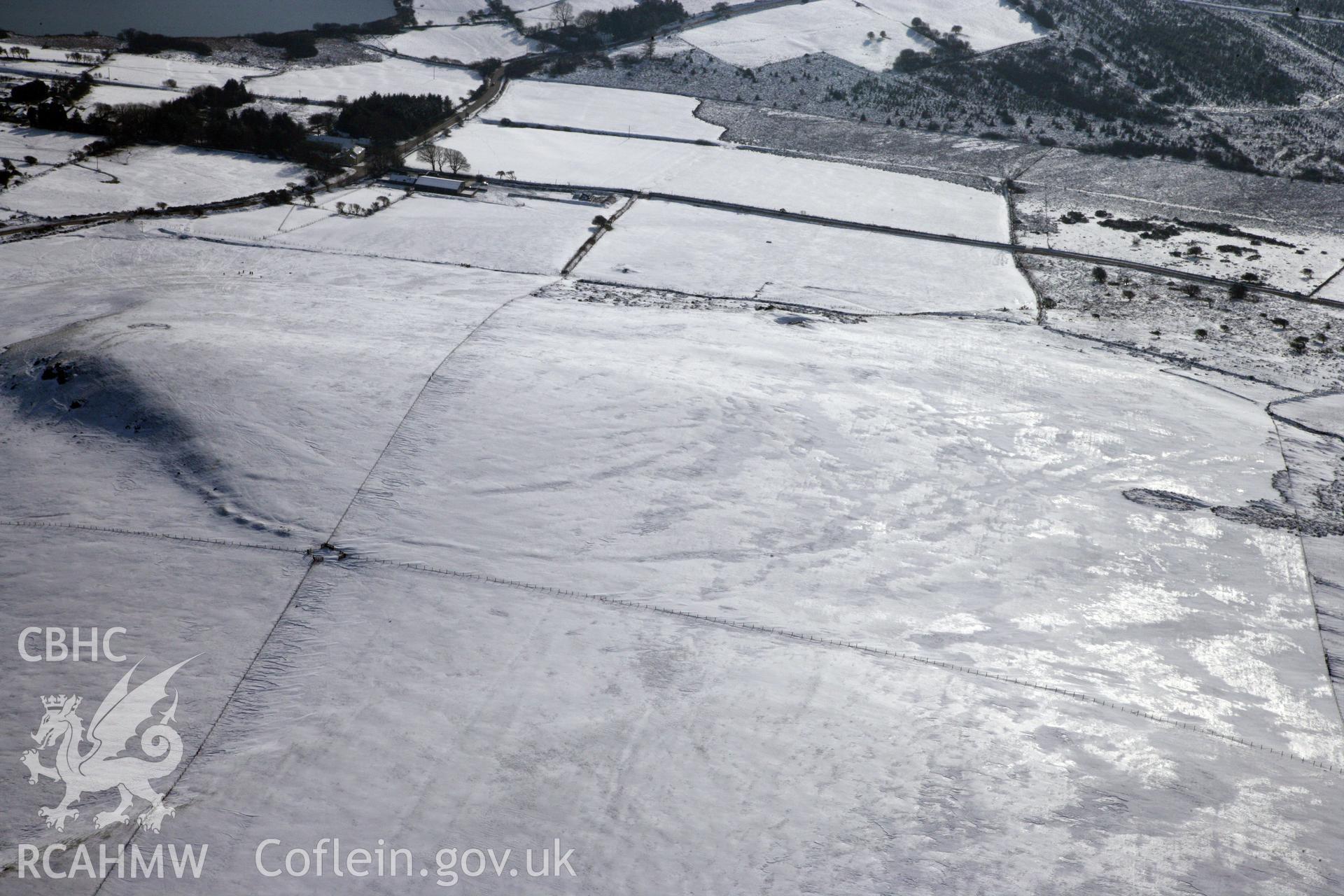 RCAHMW colour oblique photograph of Banc Du Neolithic Enclosure. Taken by Toby Driver on 02/02/2012.