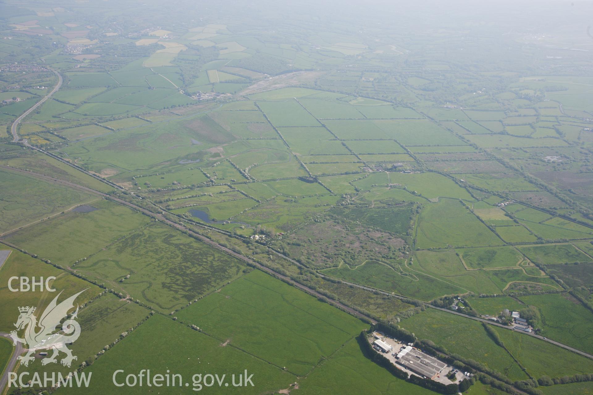 RCAHMW colour oblique photograph of General view looking north east including Kidwelly and Llanelli Canal. Taken by Toby Driver on 24/05/2012.