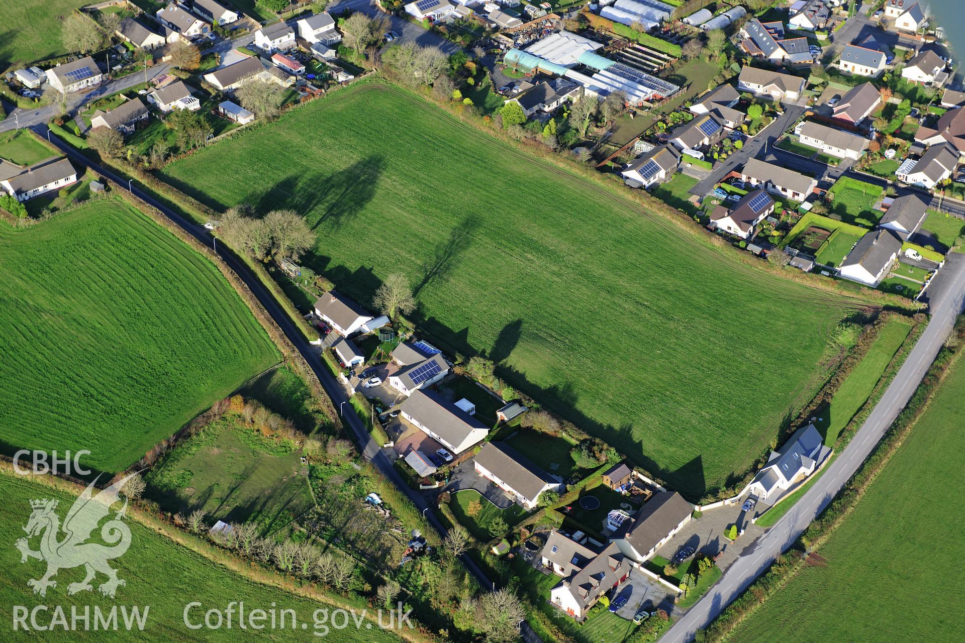 RCAHMW colour oblique photograph of Crug Swllt Round Barrow, Tavernspite. Taken by Toby Driver on 26/10/2012.