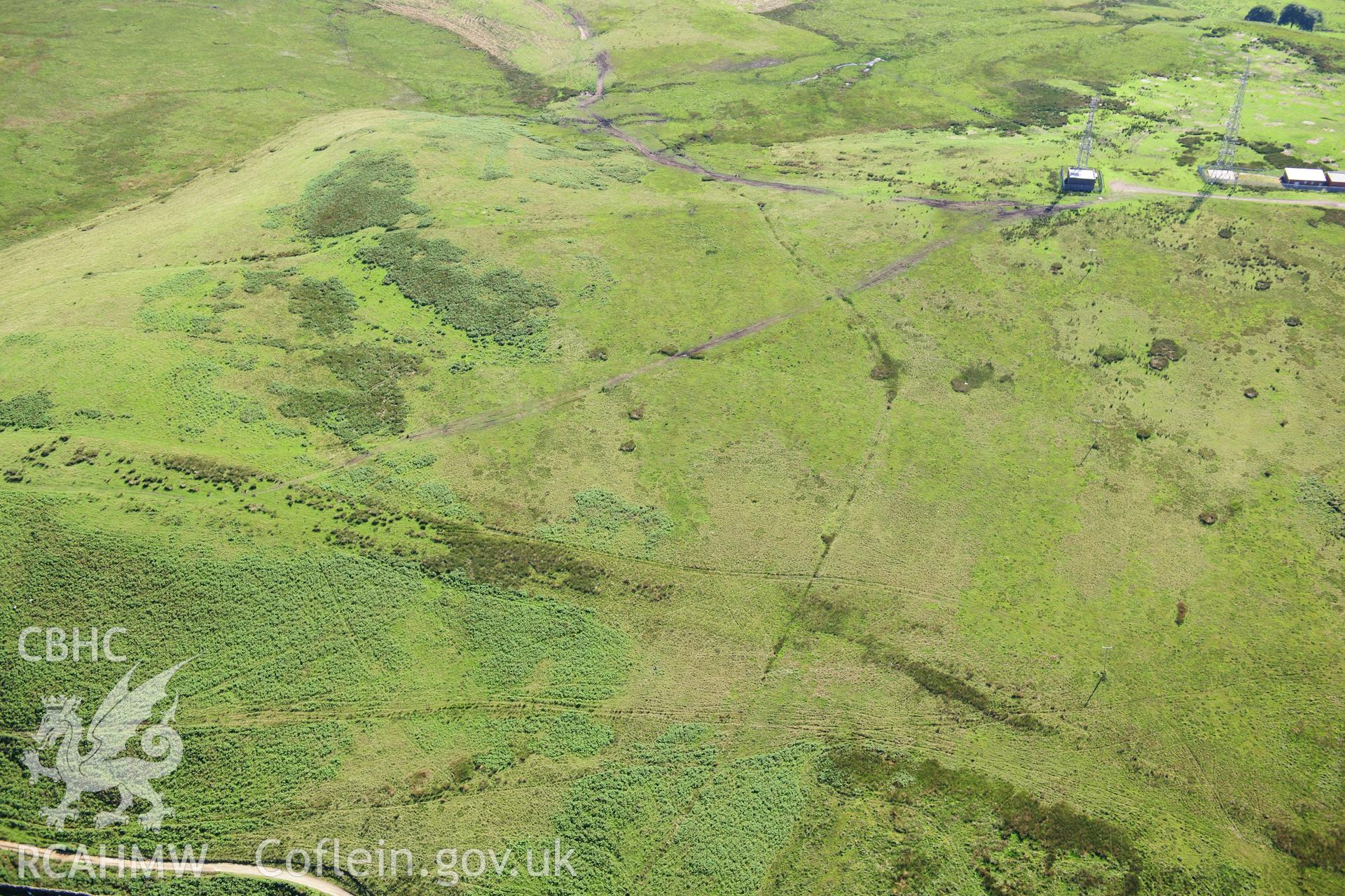 RCAHMW colour oblique photograph of Cross Ridge Dyke and Cairn on Tywn Hywel. Taken by Toby Driver on 24/07/2012.